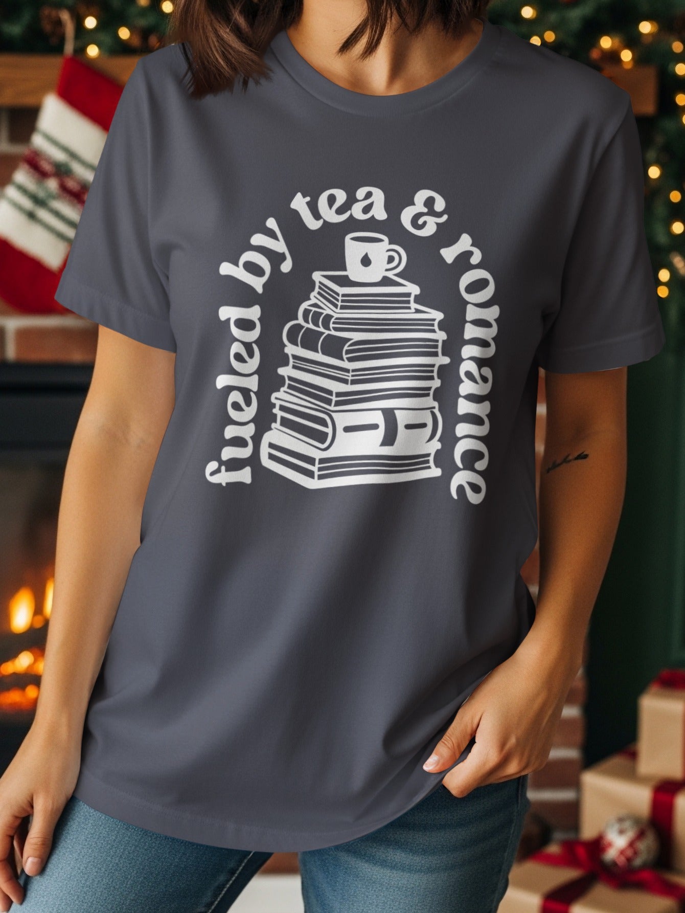 Fueled by tea and romance graphic on a dark grey t-shirt.