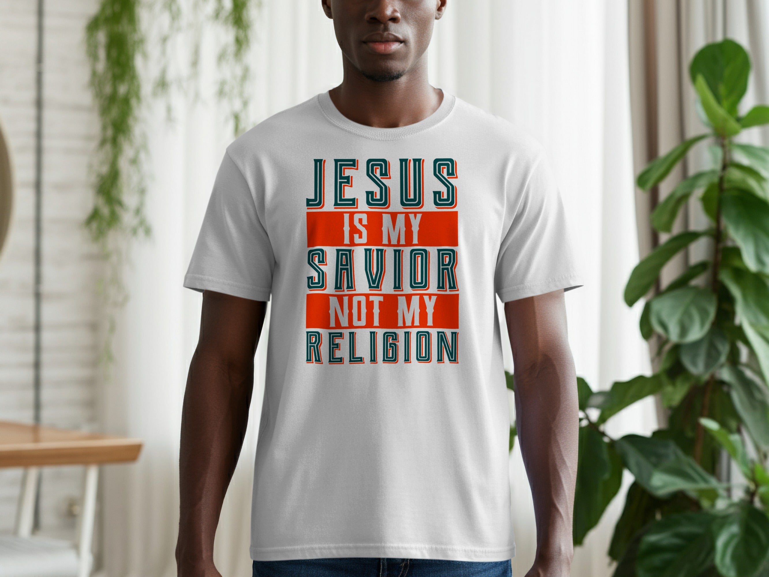White t-shirt with text "Jesus is my savior not my religion".