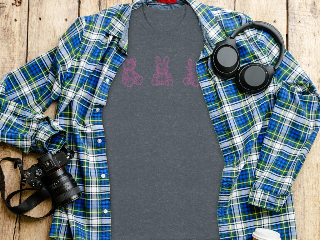 Dark gray t-shirt with pink wireframe animals, open plaid shirt, headphones, camera, and coffee cup.