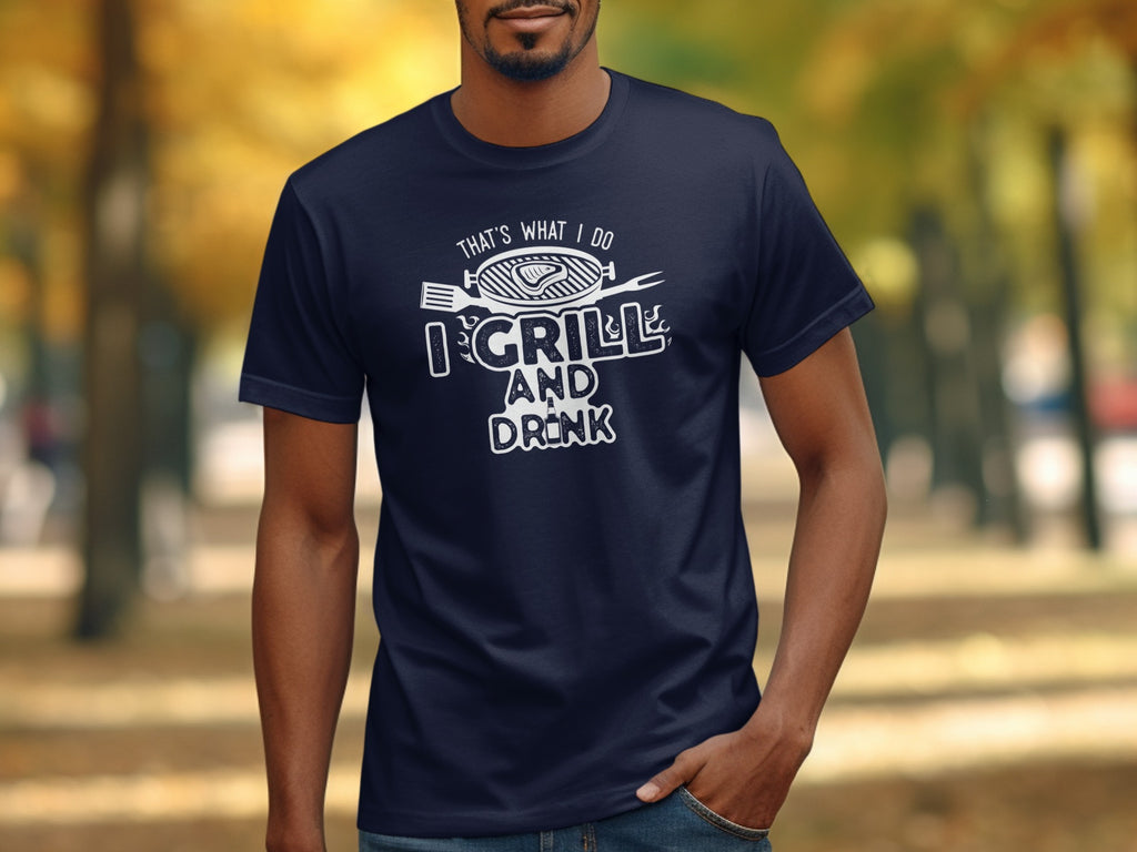 Navy t-shirt with "That's What I Do I Grill and Drink" and grilling graphic.