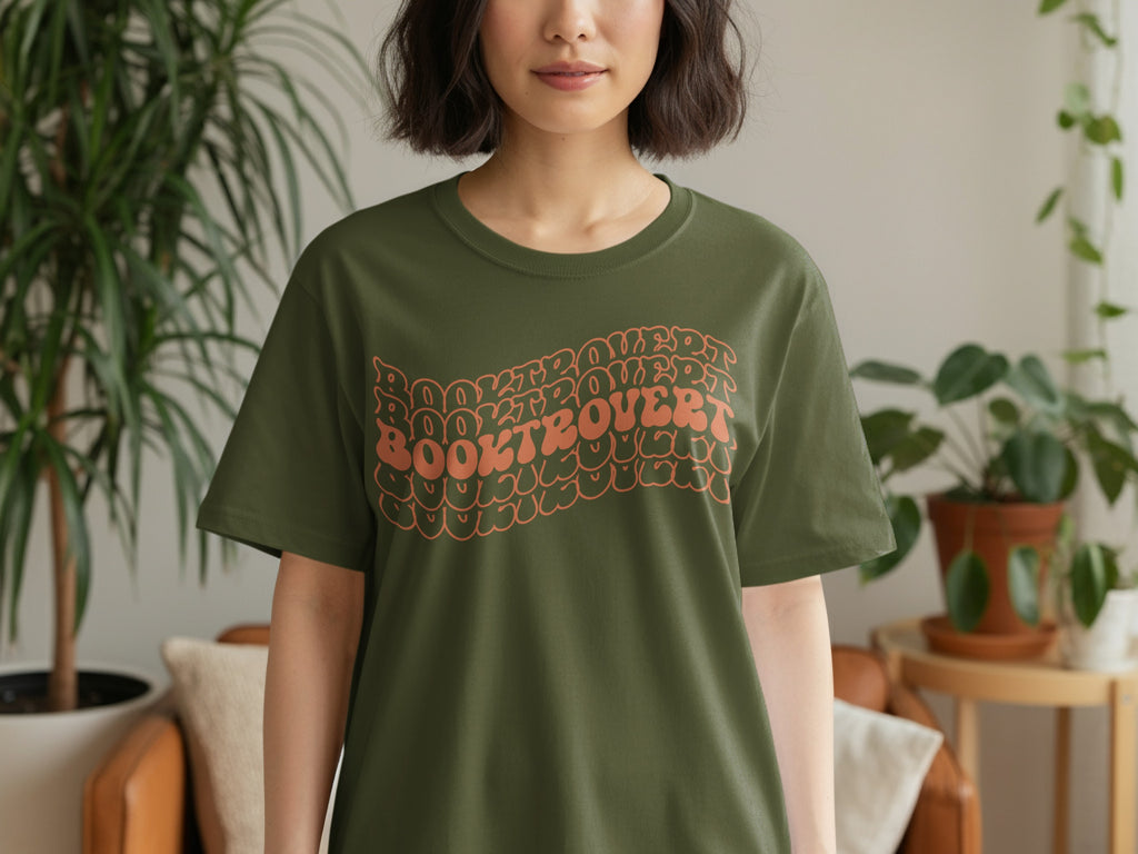 Olive green t-shirt with wavy "Booktrovert" text graphic.