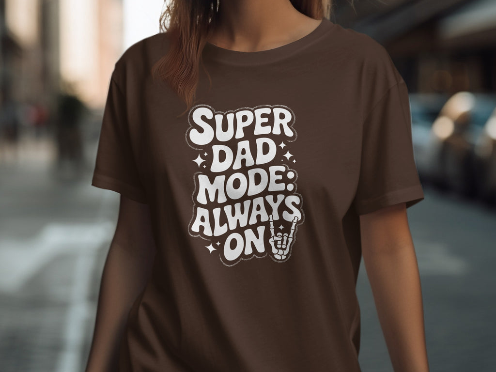 Brown t-shirt with "Super Dad Mode: Always On" text and skeleton hand.