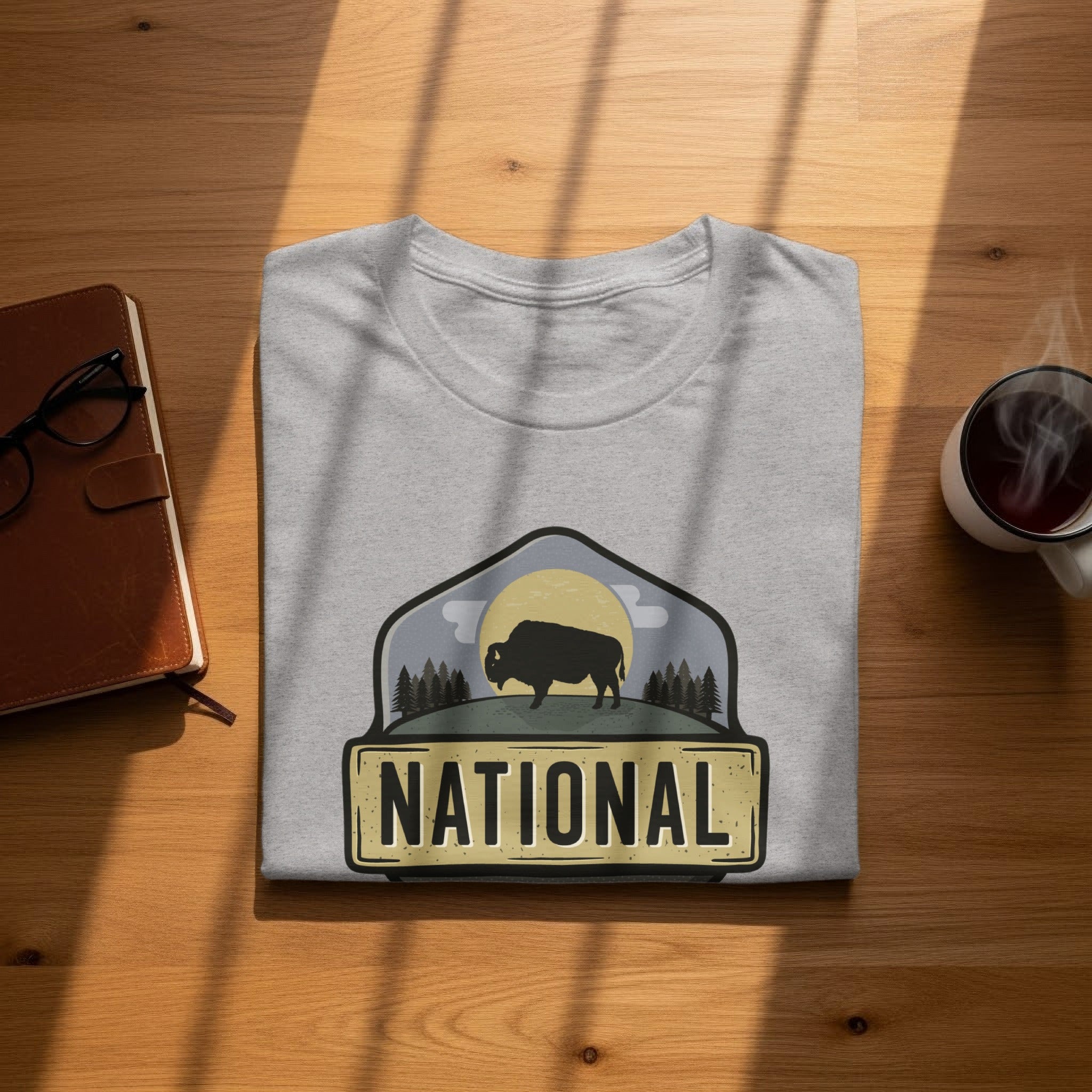 Grey t-shirt with a bison in a landscape design and the word "NATIONAL".