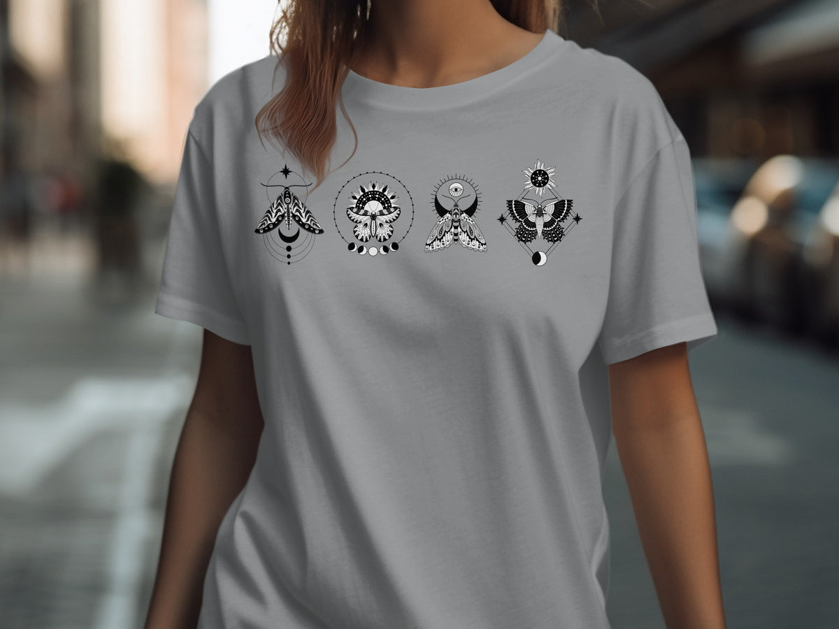 Grey t-shirt with four black and white moth designs featuring celestial elements.