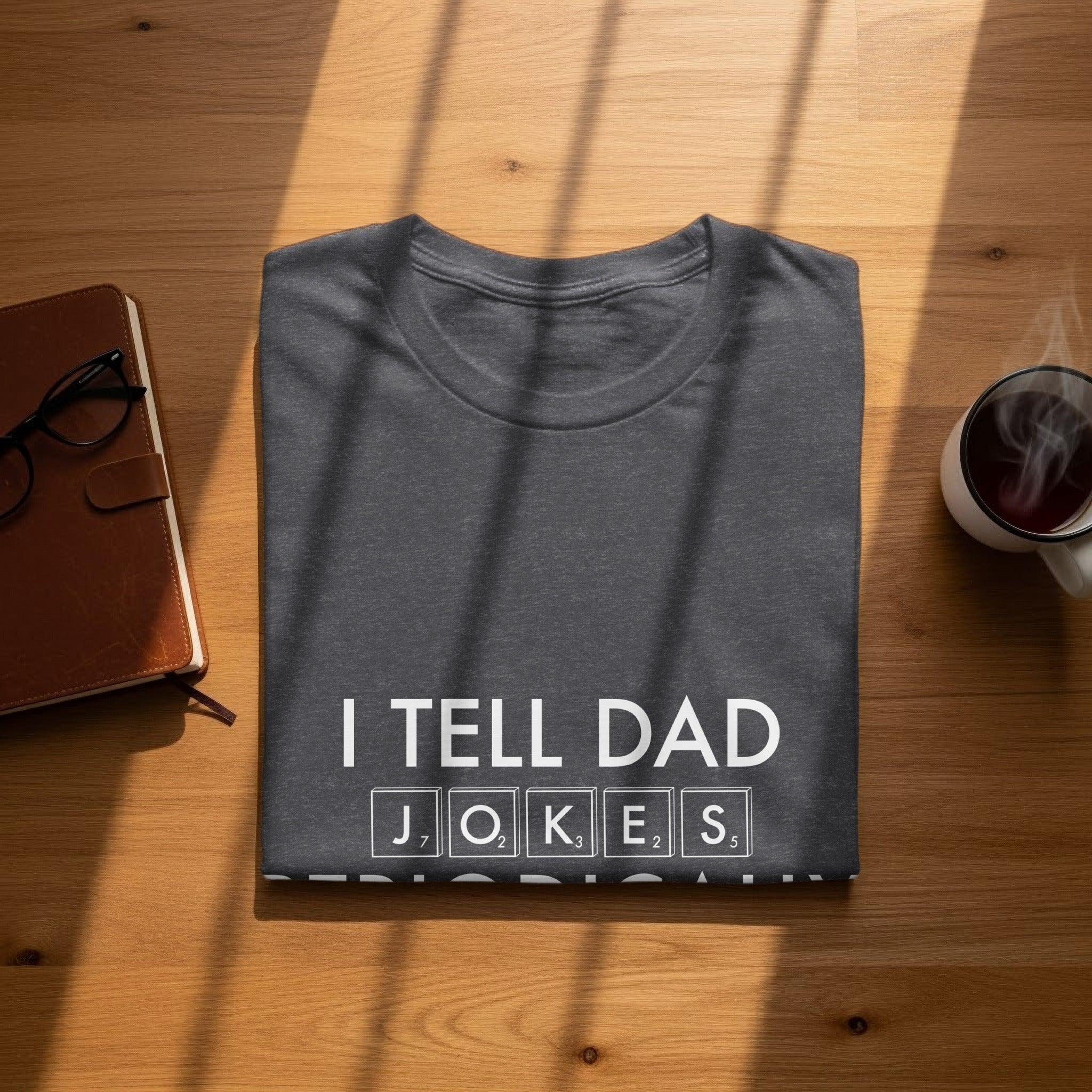 Dark gray t-shirt with "I TELL DAD JOKES" in white letters.