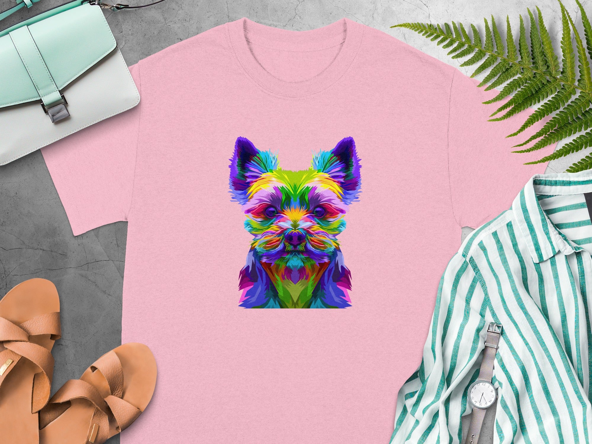 Pink t-shirt with a colorful geometric dog face print.