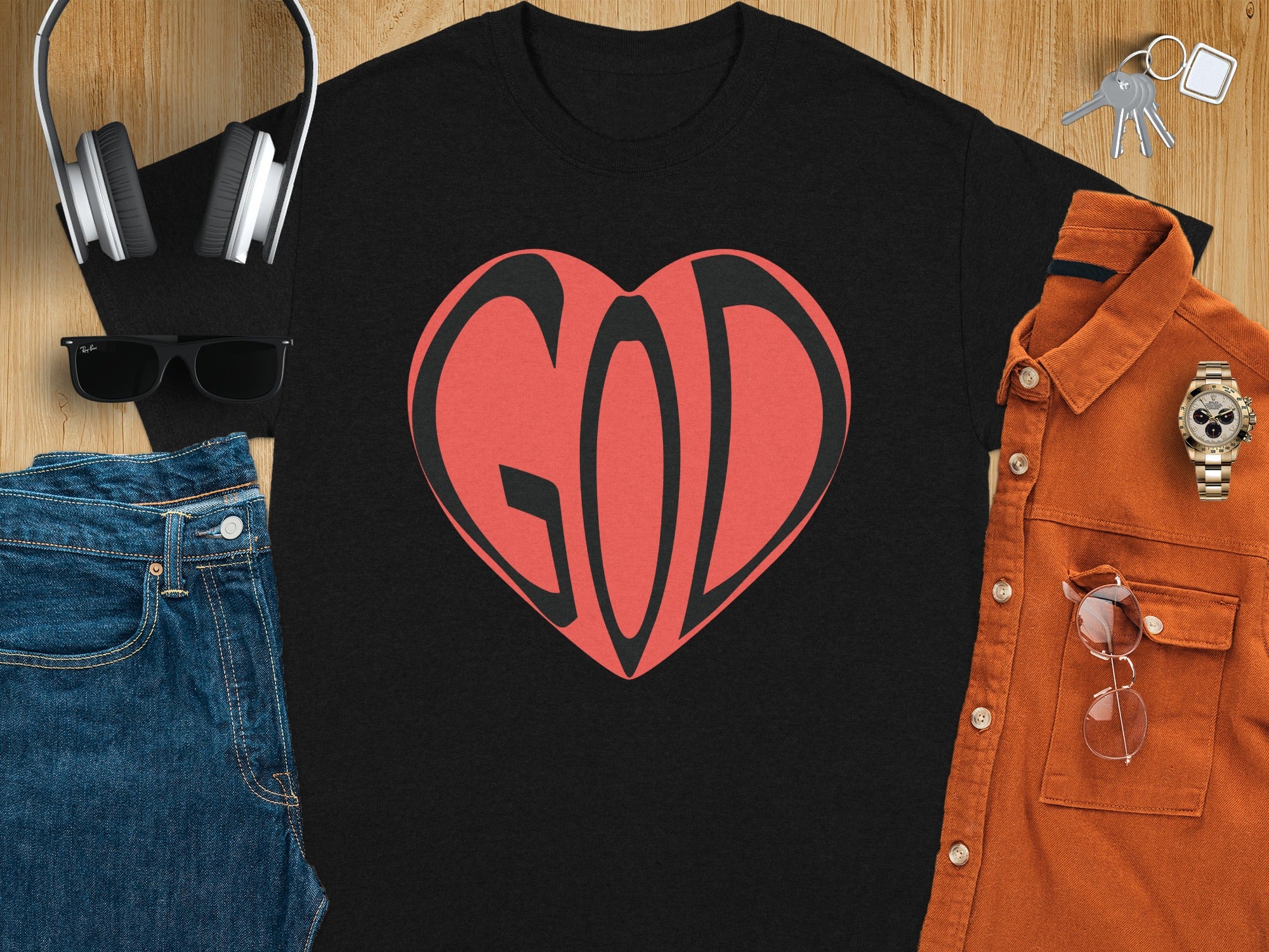 Black t-shirt with a red and black heart graphic spelling "GOD".