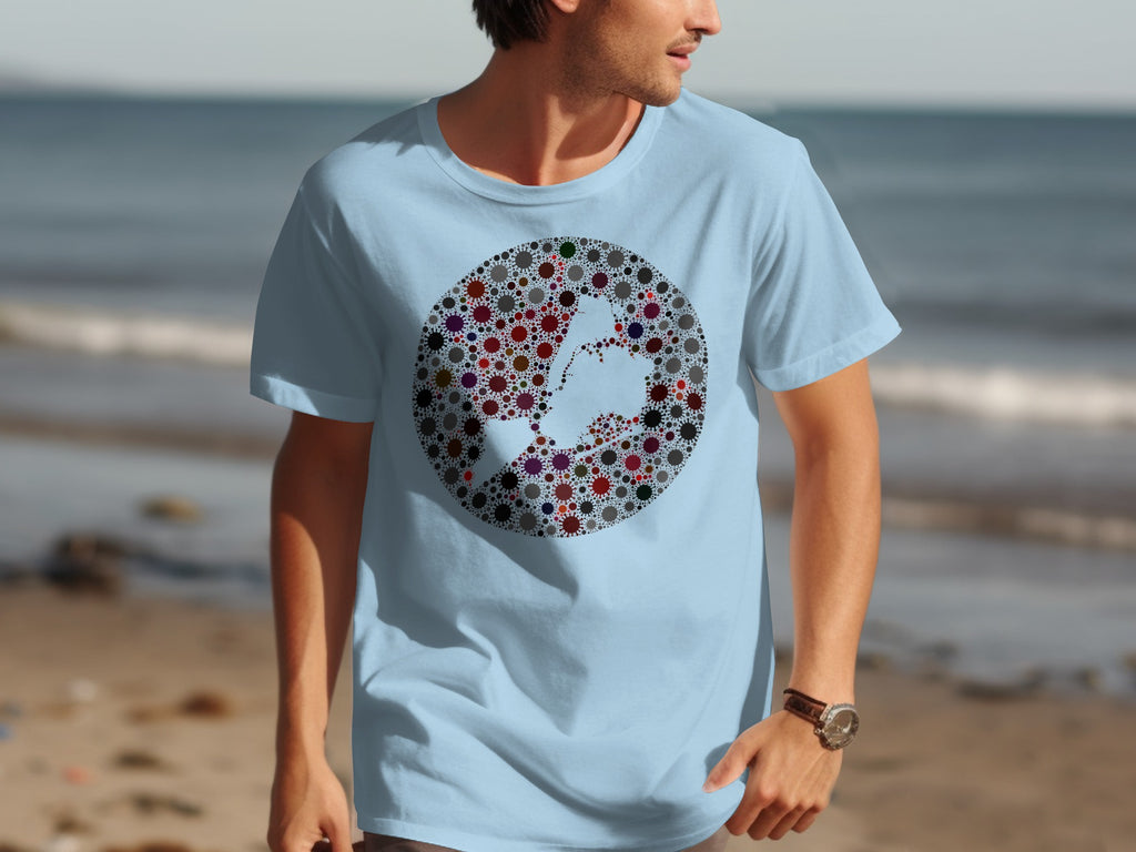 Light blue t-shirt with a circular design of colorful virus-like shapes forming a map silhouette.