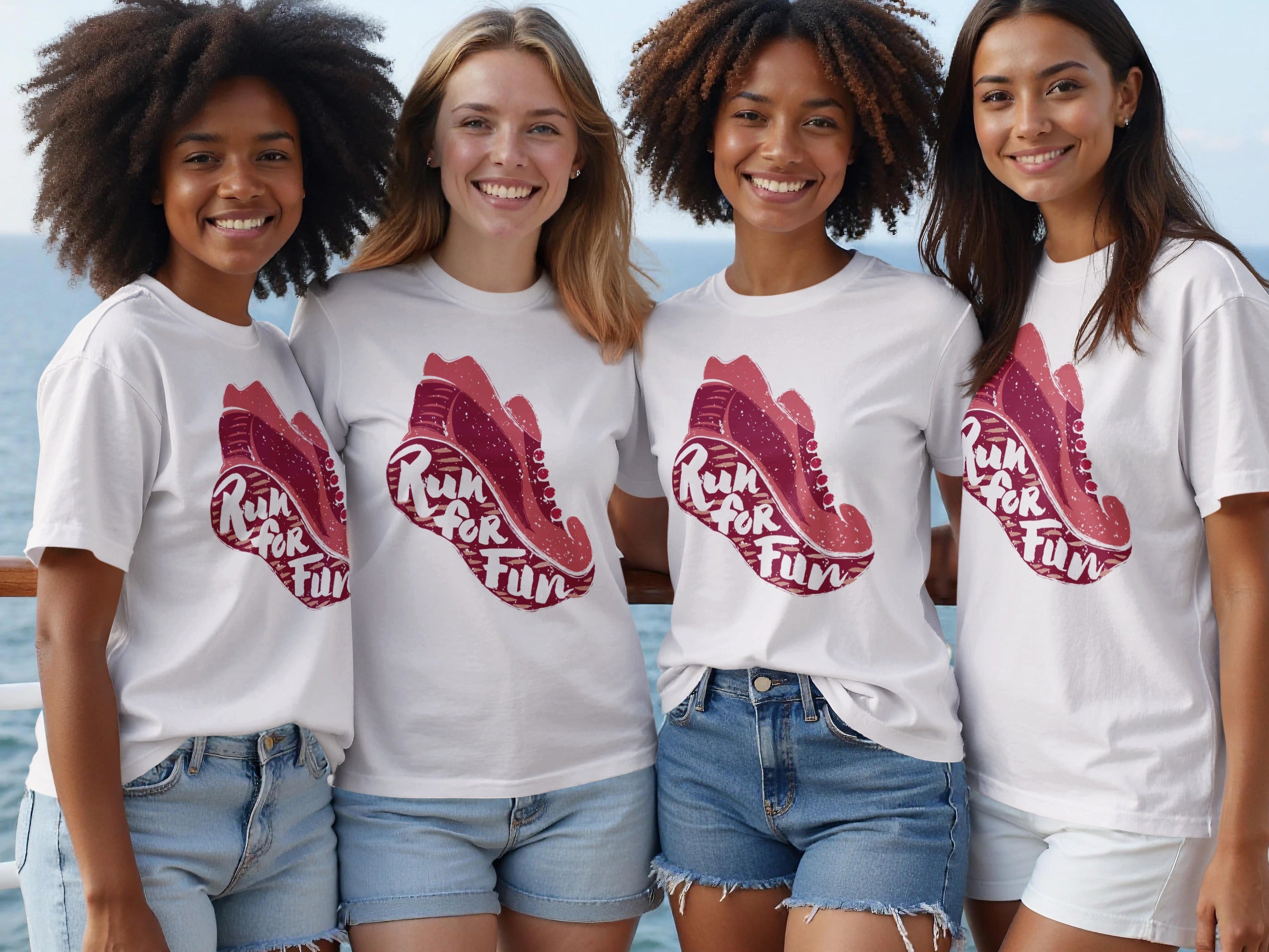 Four women smiling on a boat wearing white t-shirts with a graphic of a shoe and text.