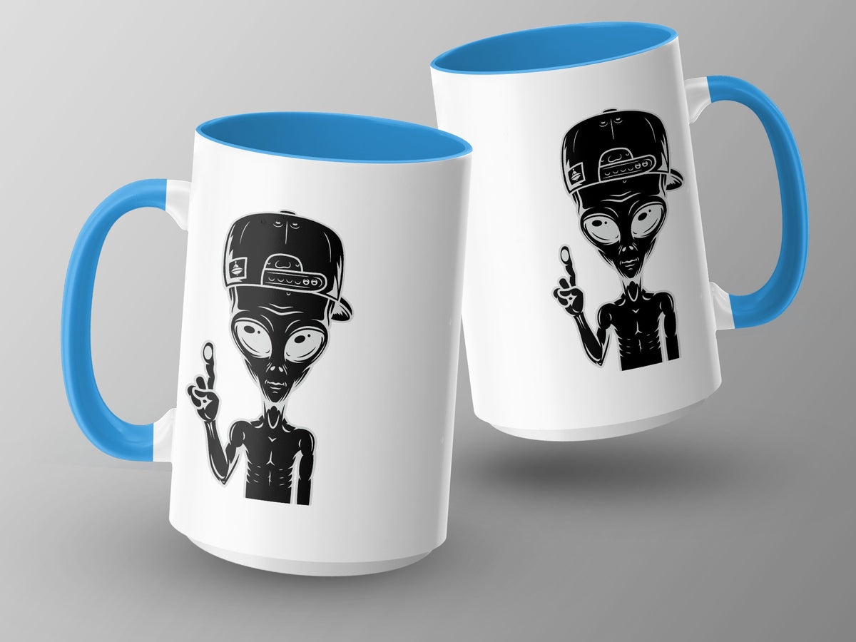 Two white mugs with blue interiors and handles, featuring alien designs.