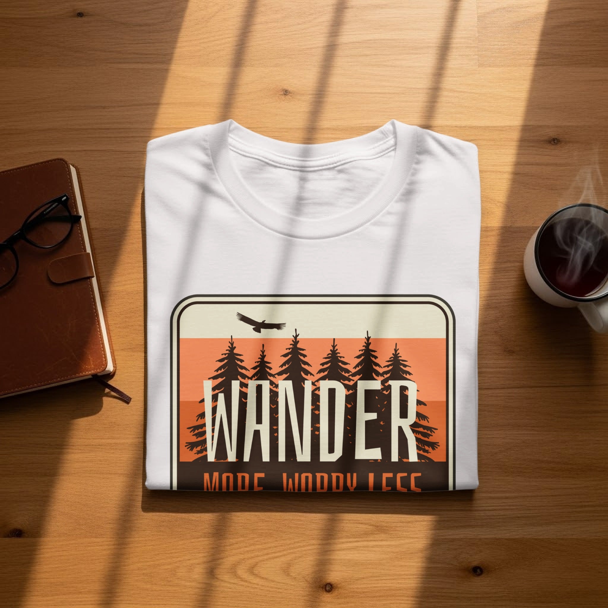 White t-shirt with "WANDER MODE: WOODY LESS" graphic and forest scene.