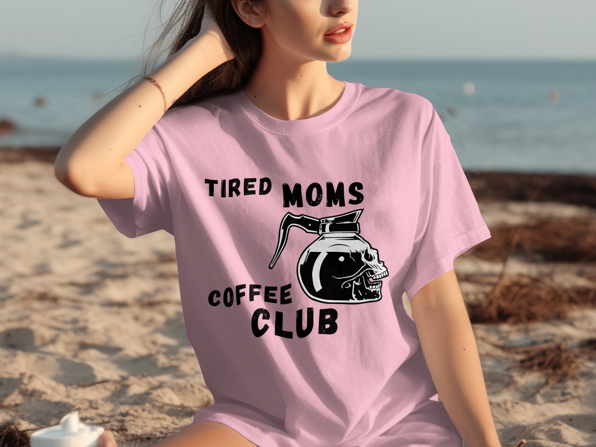 Pink t-shirt with "Tired Moms Coffee Club" text and skull coffee pot graphic.
