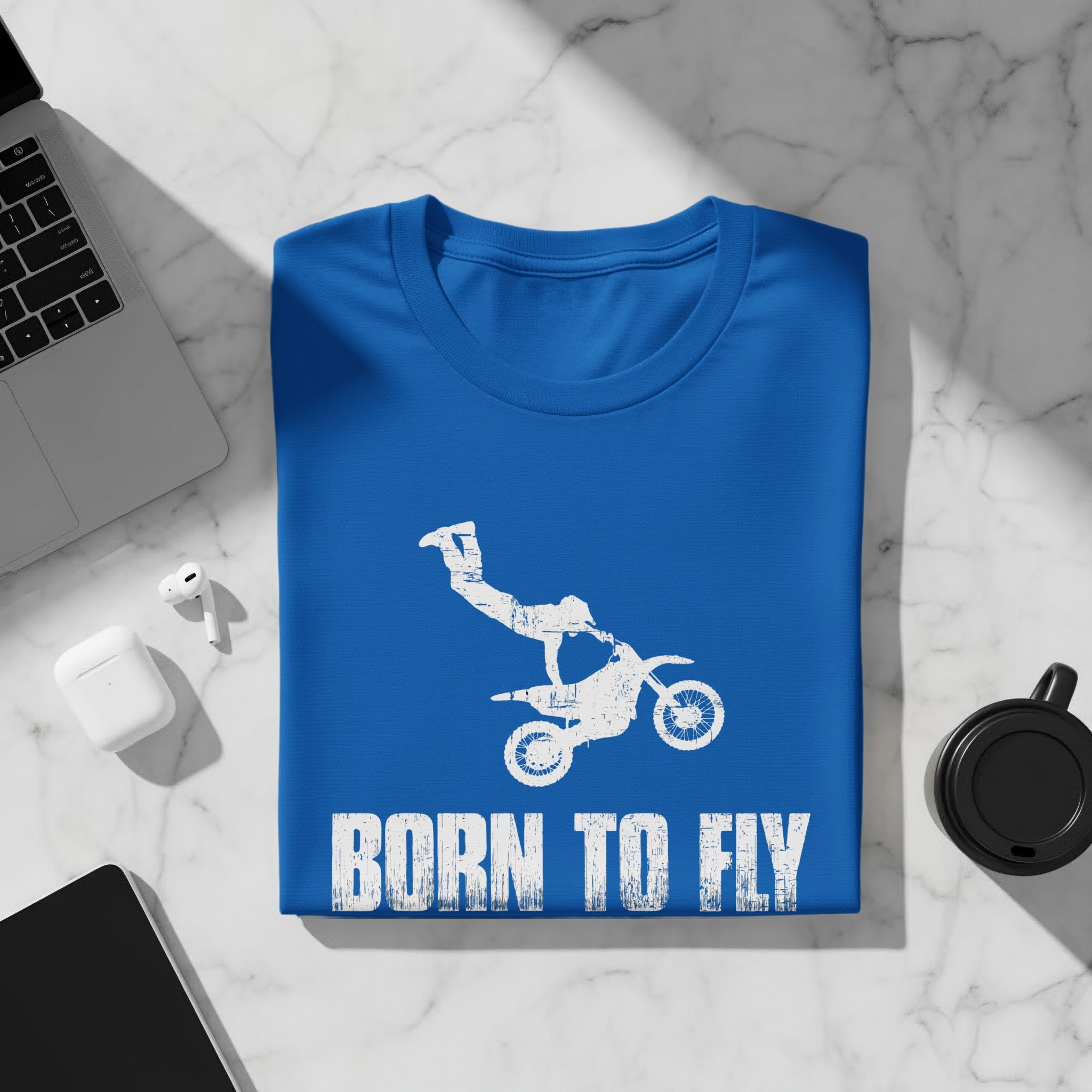 Blue t-shirt with white distressed motocross rider and text "BORN TO FLY".