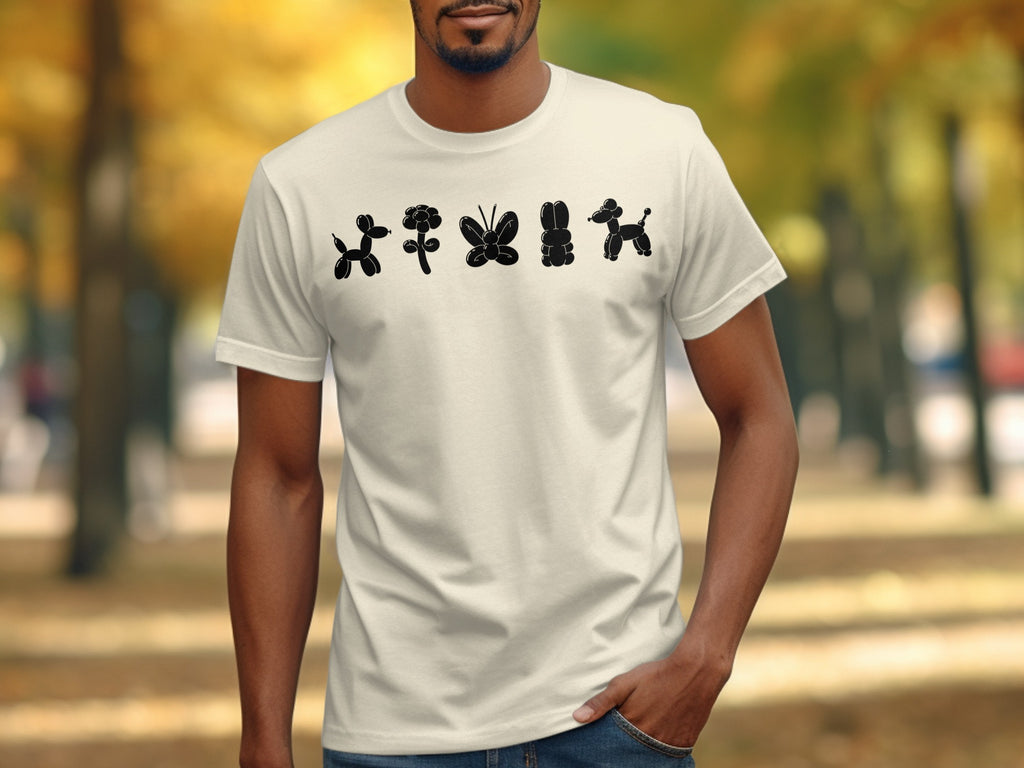 White t-shirt with black balloon animal designs of dogs, flower, butterfly, rabbit, and dog.