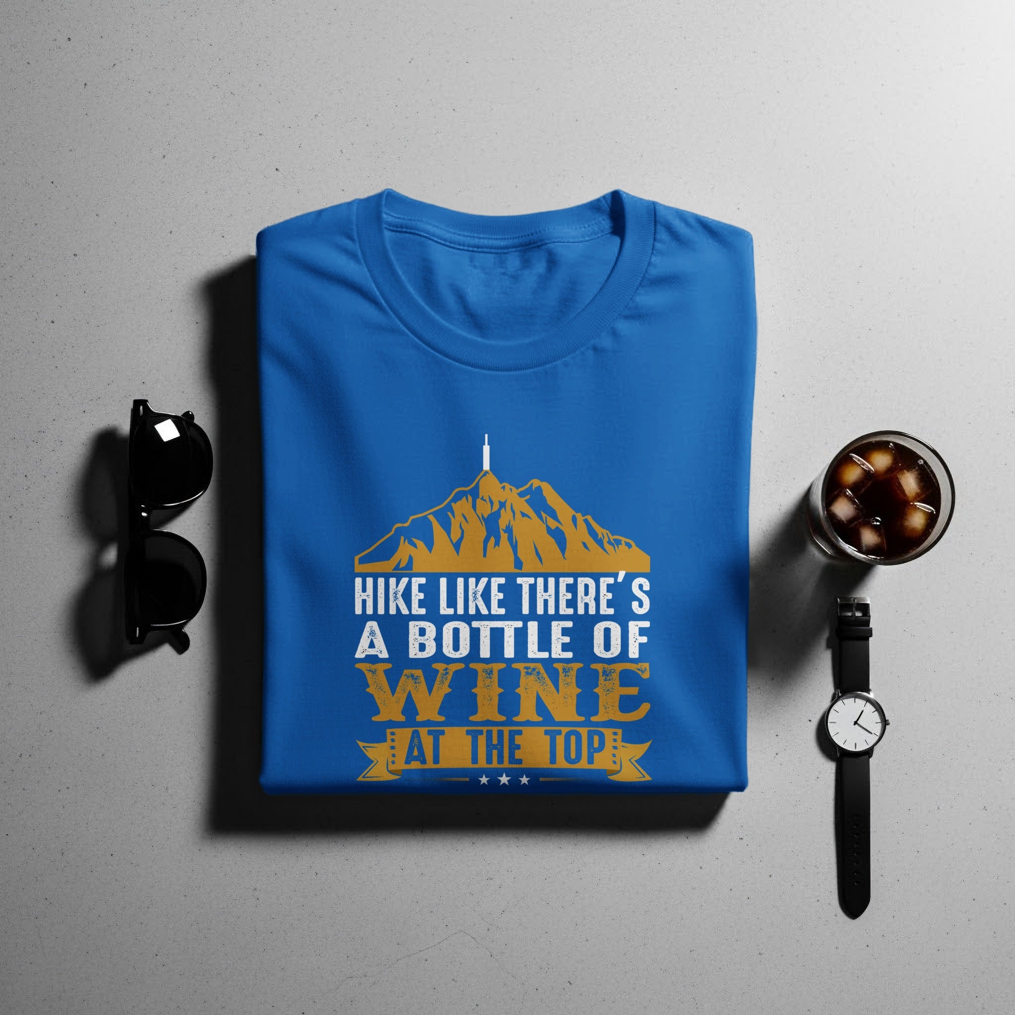 Blue t-shirt with text "HIKE LIKE THERE'S A BOTTLE OF WINE AT THE TOP".