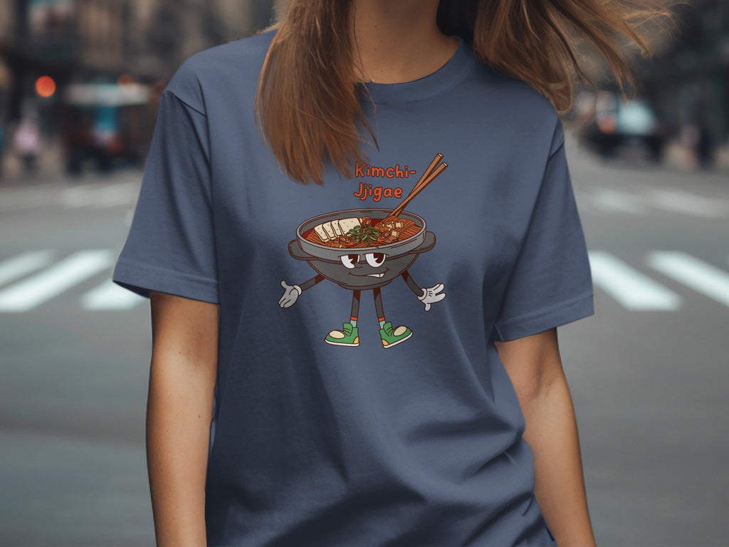 T-shirt featuring a cartoon kimchi jjigae pot with arms, legs, and chopsticks.