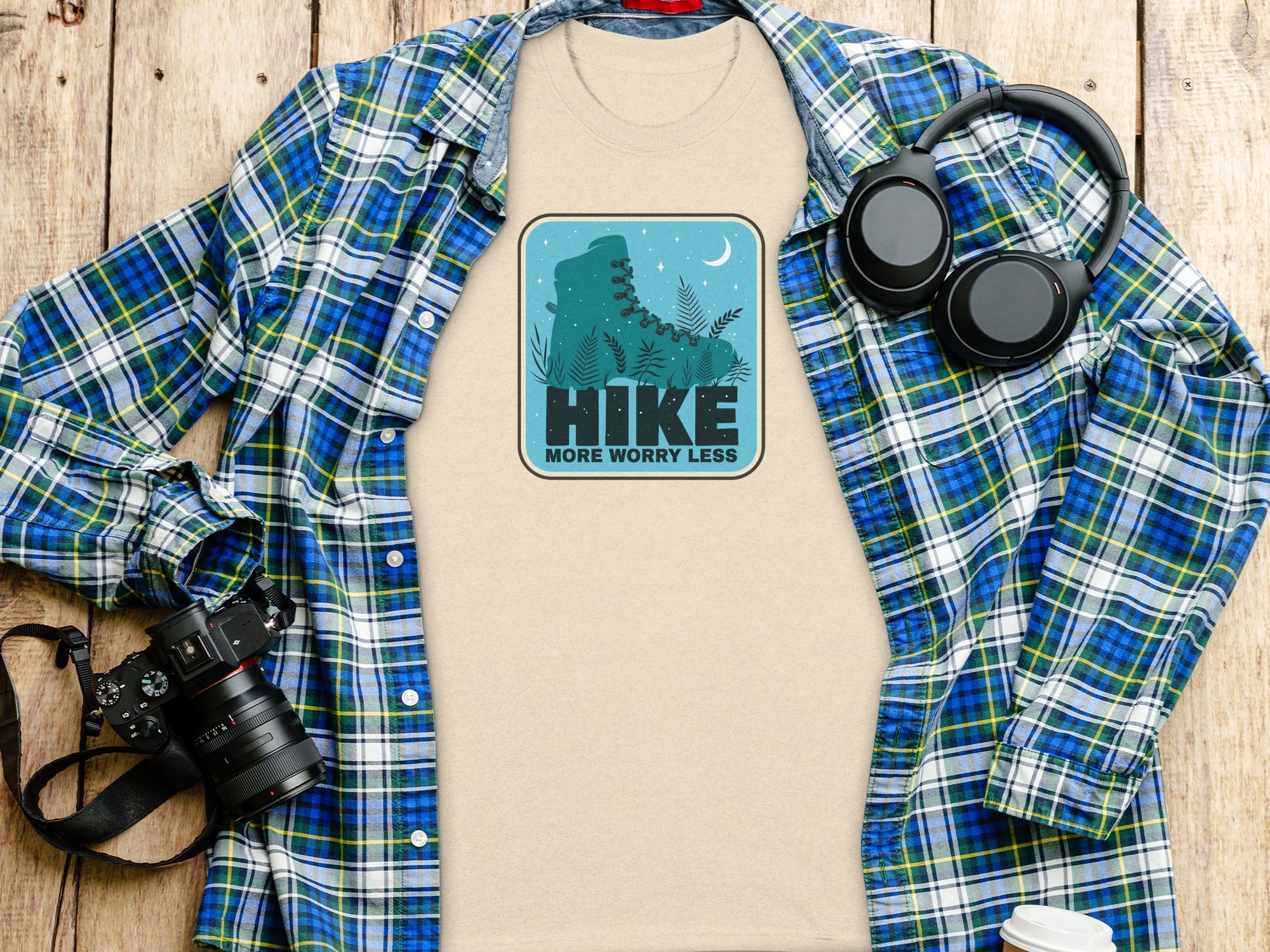 T-shirt with "HIKE MORE WORRY LESS" graphic of a boot and moon.