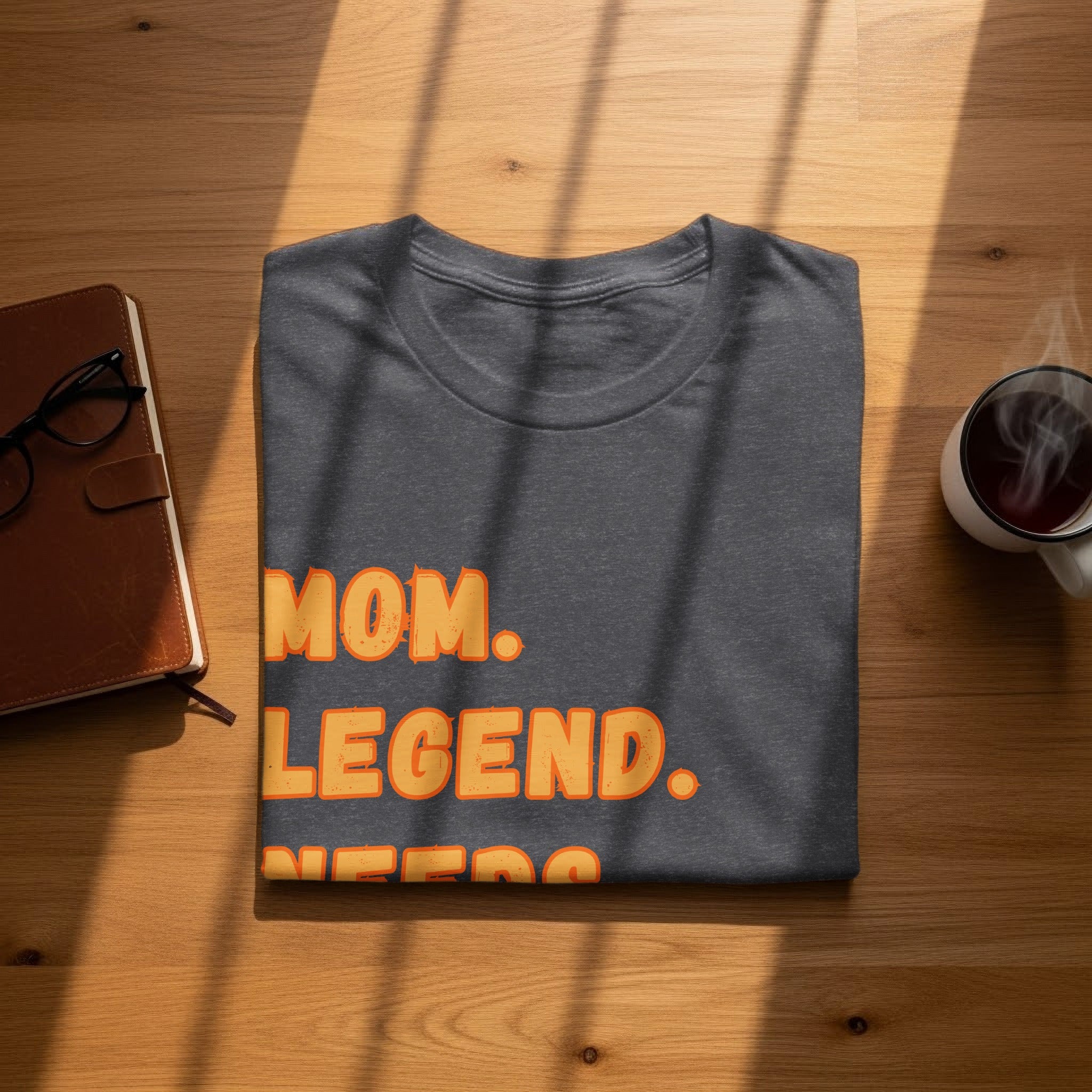 Charcoal t-shirt with orange text "MOM. LEGEND.".