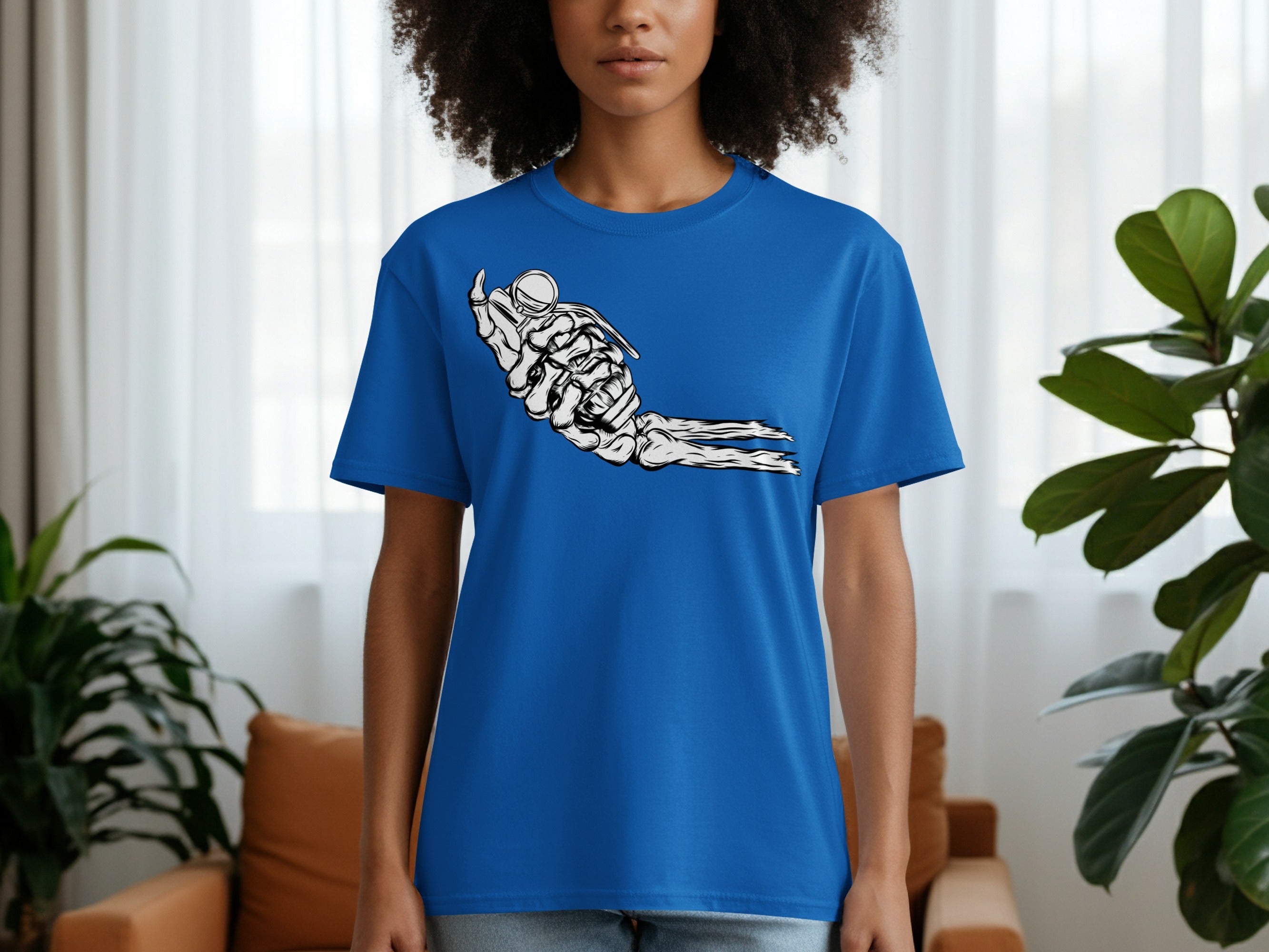 Blue t-shirt with a black and white graphic of a skeleton hand holding a grenade.
