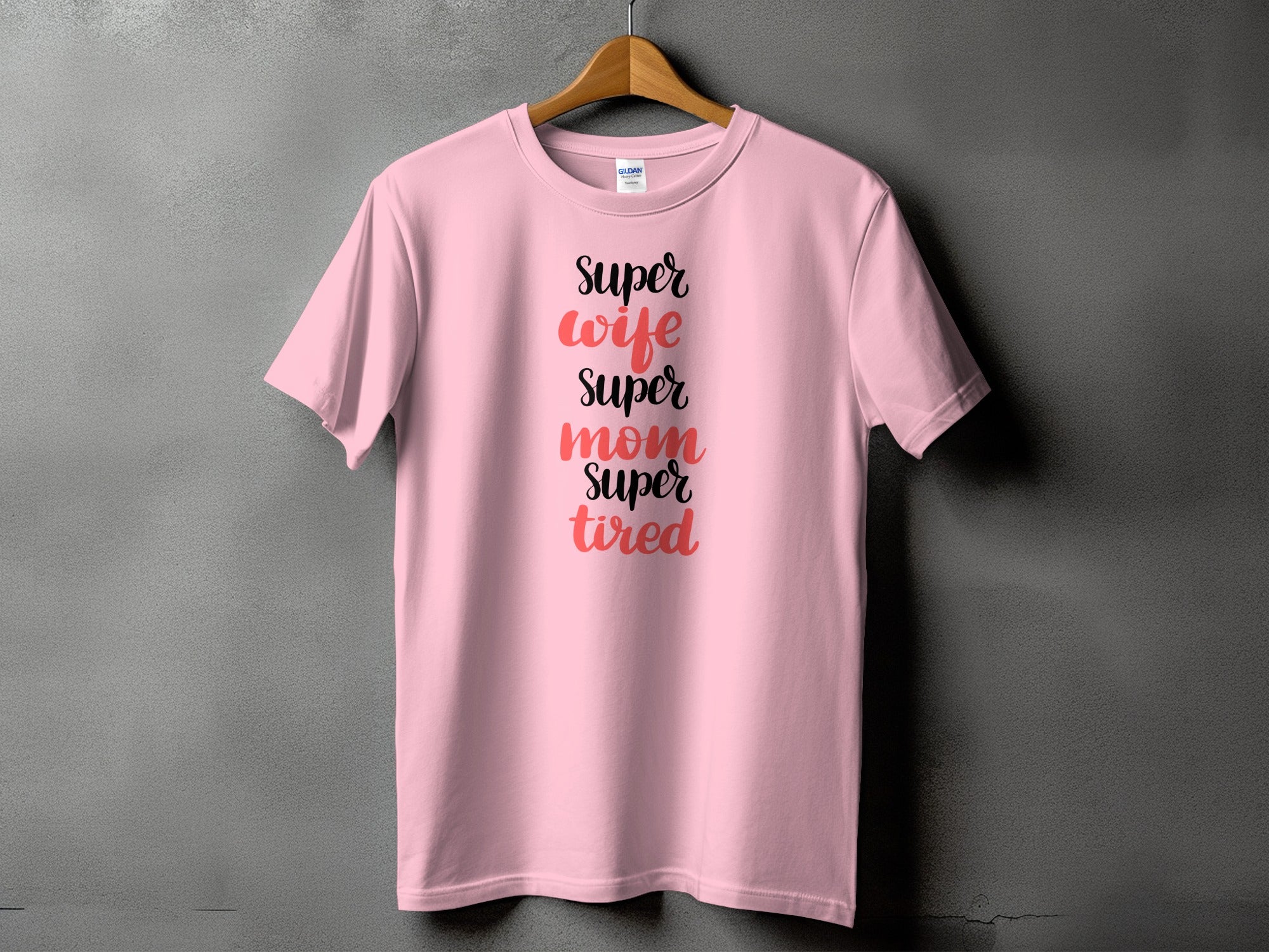 Pink t-shirt with text "Super wife super mom super tired".