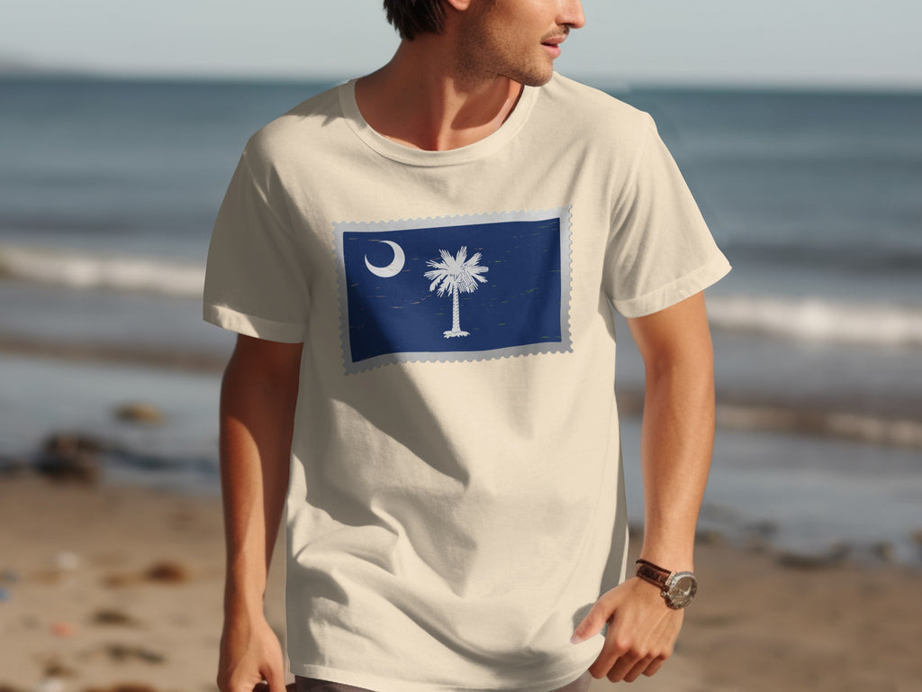 Cream t-shirt with South Carolina flag design above a beach scene.