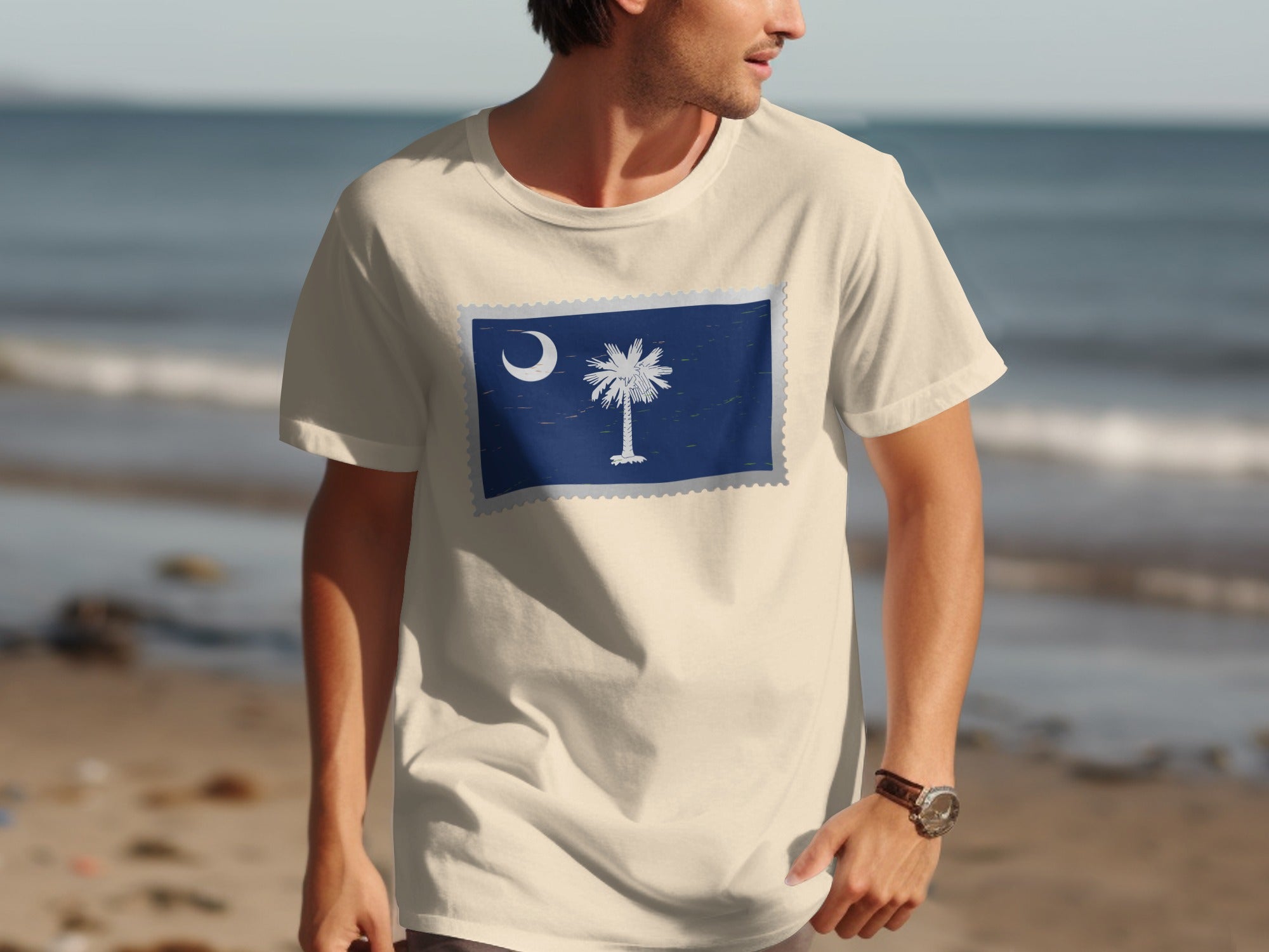 Cream t-shirt with South Carolina flag design above a beach scene.