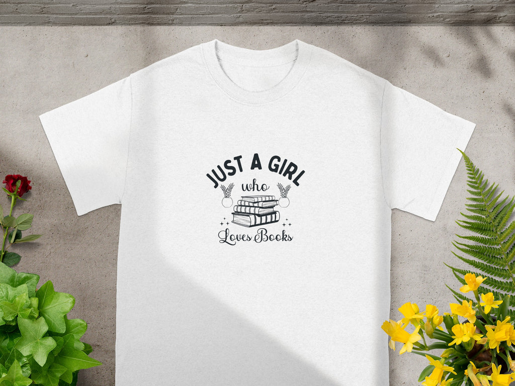 White t-shirt with "Just a girl who loves books" text and stacked books graphic.