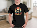 Black t-shirt with cat wearing sunglasses graphic and text "BEST CAT DAD EVER".