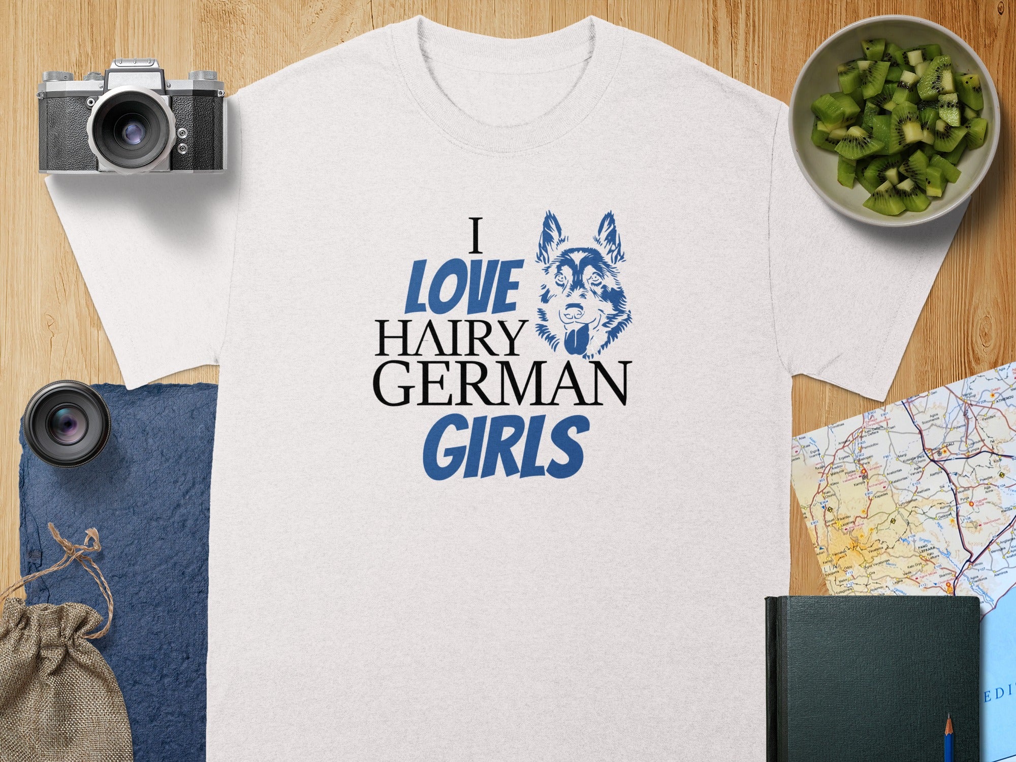 White t-shirt with blue text "I LOVE HAIRY GERMAN GIRLS" and wolf graphic.
