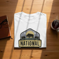 White t-shirt with a National Park graphic featuring a bison and trees.