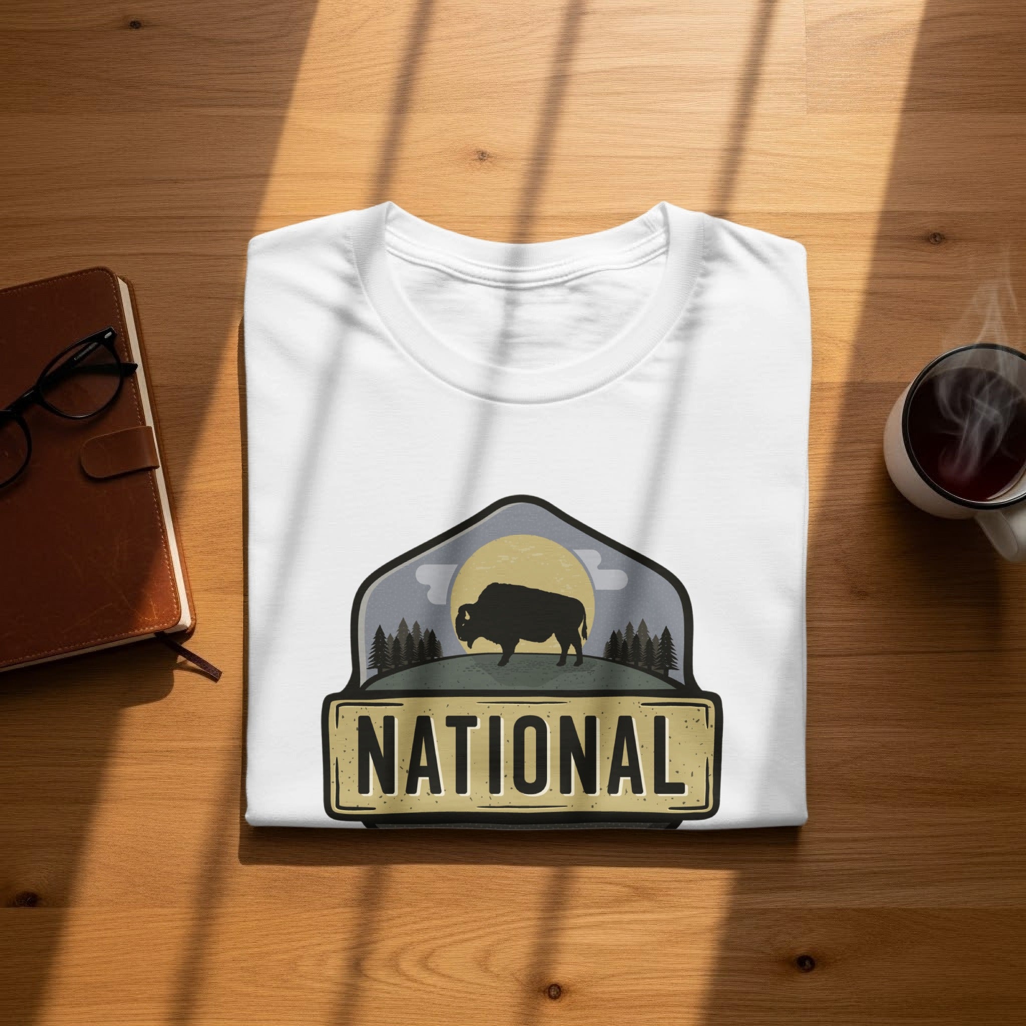 White t-shirt with a National Park graphic featuring a bison and trees.