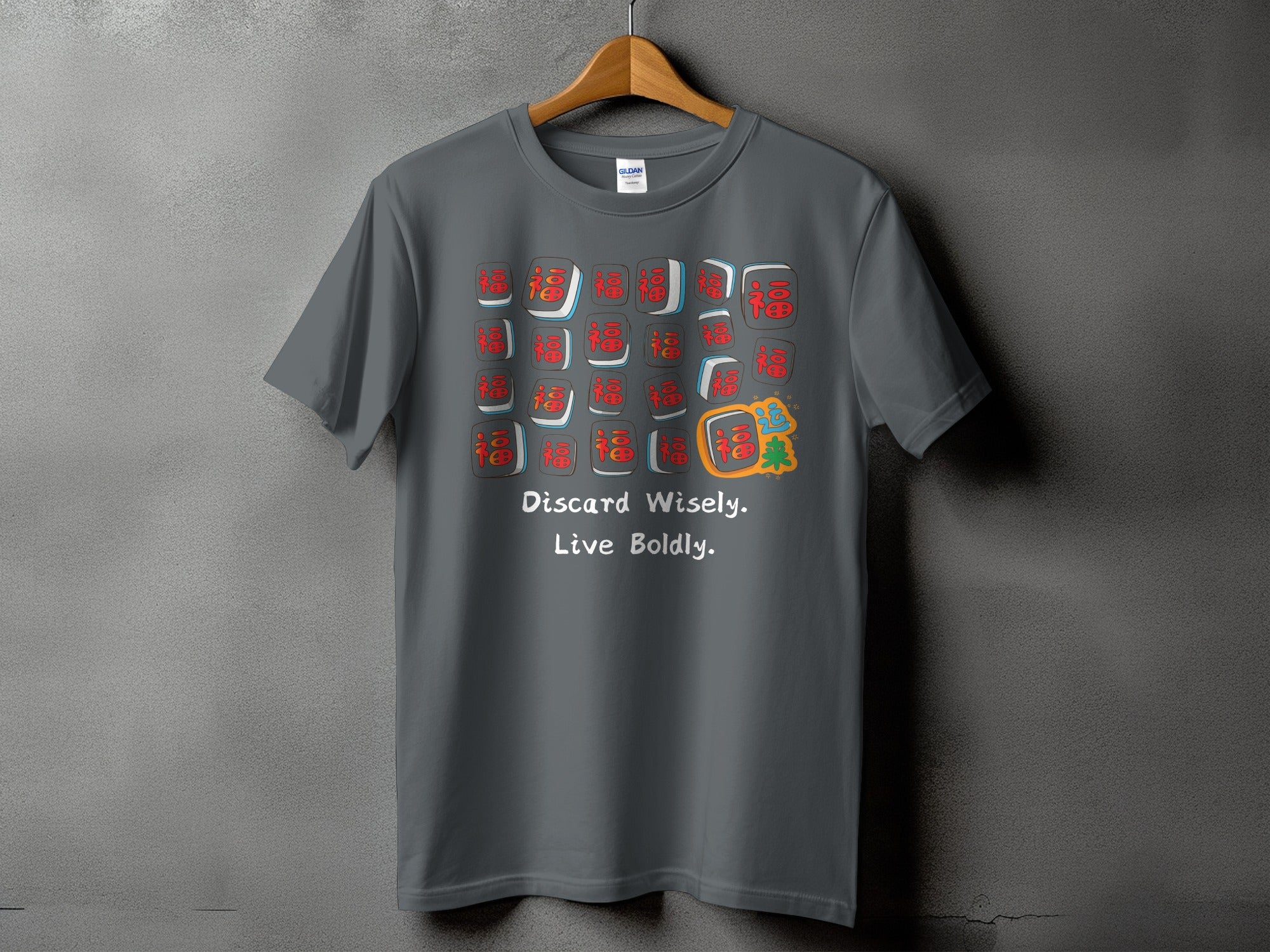Gray t-shirt with Mahjong tiles and text "Discard Wisely. Live Boldly."