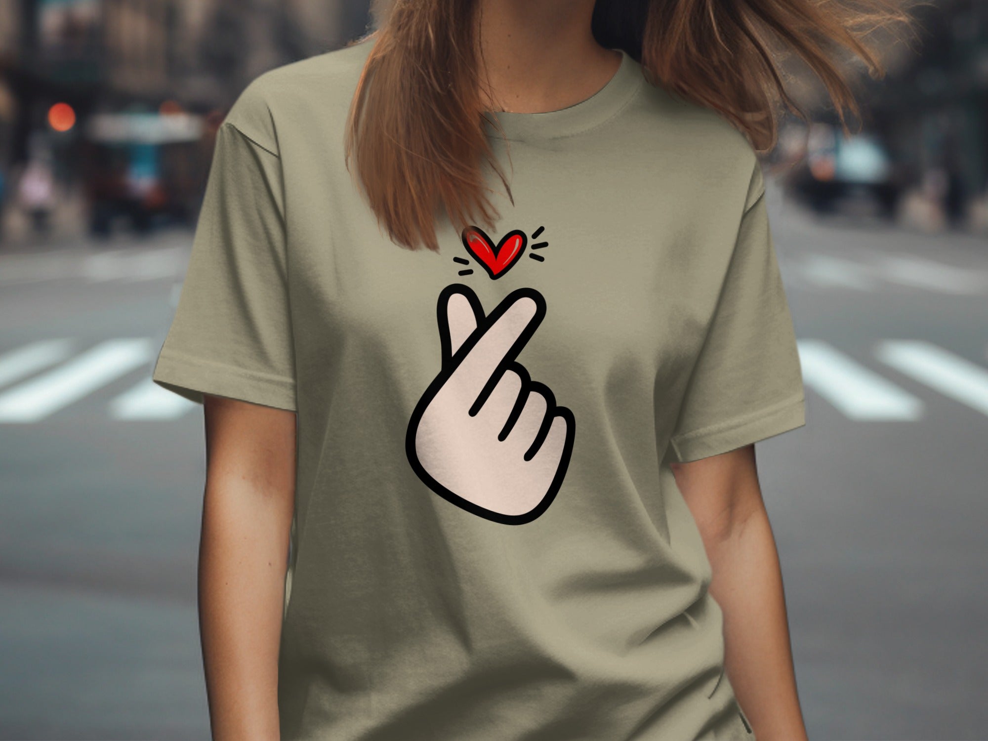 Light green t-shirt with a cartoon finger heart and red heart graphic.