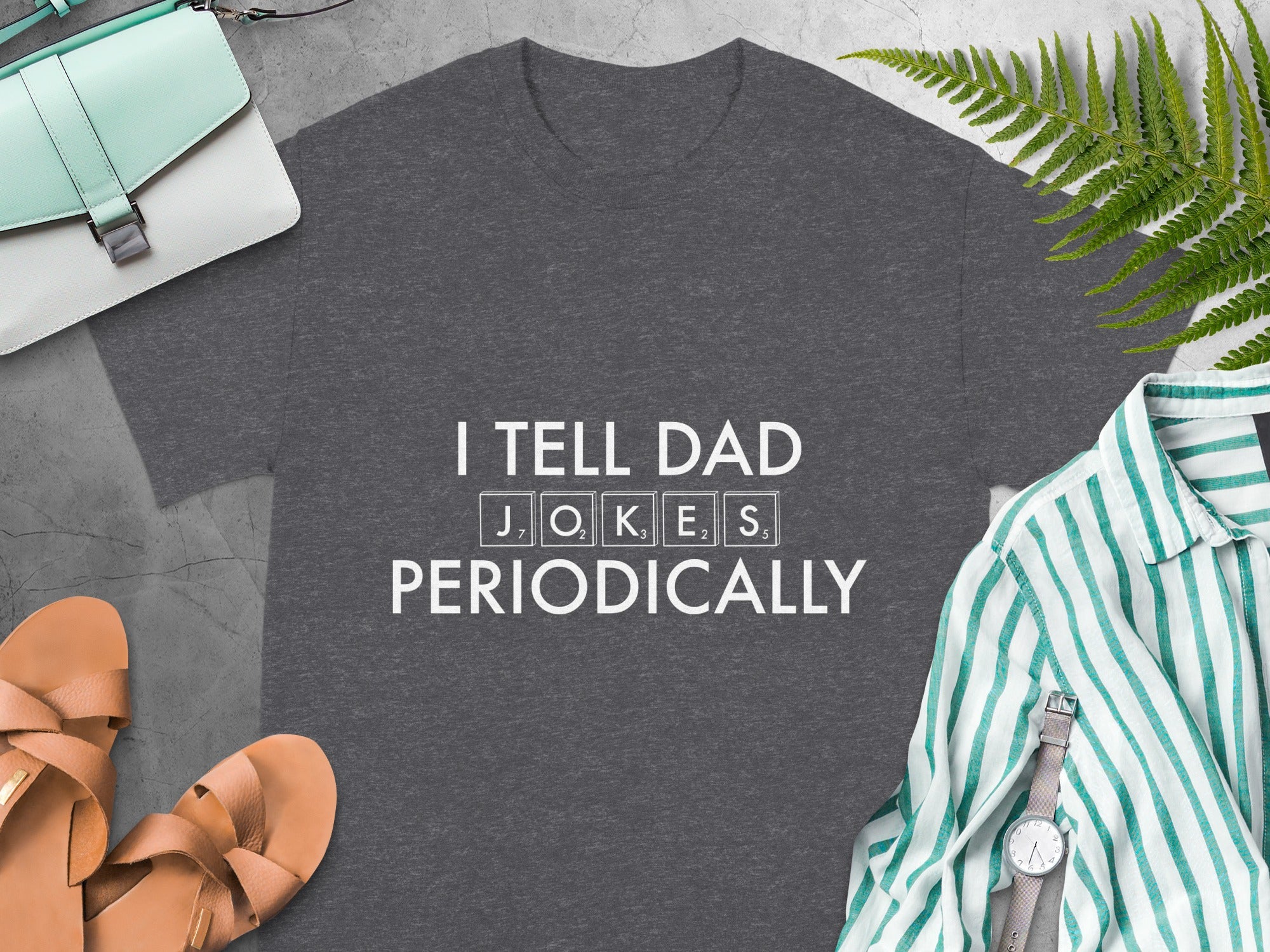 Dark grey t-shirt with white text "I TELL DAD JOKES PERIODICALLY".