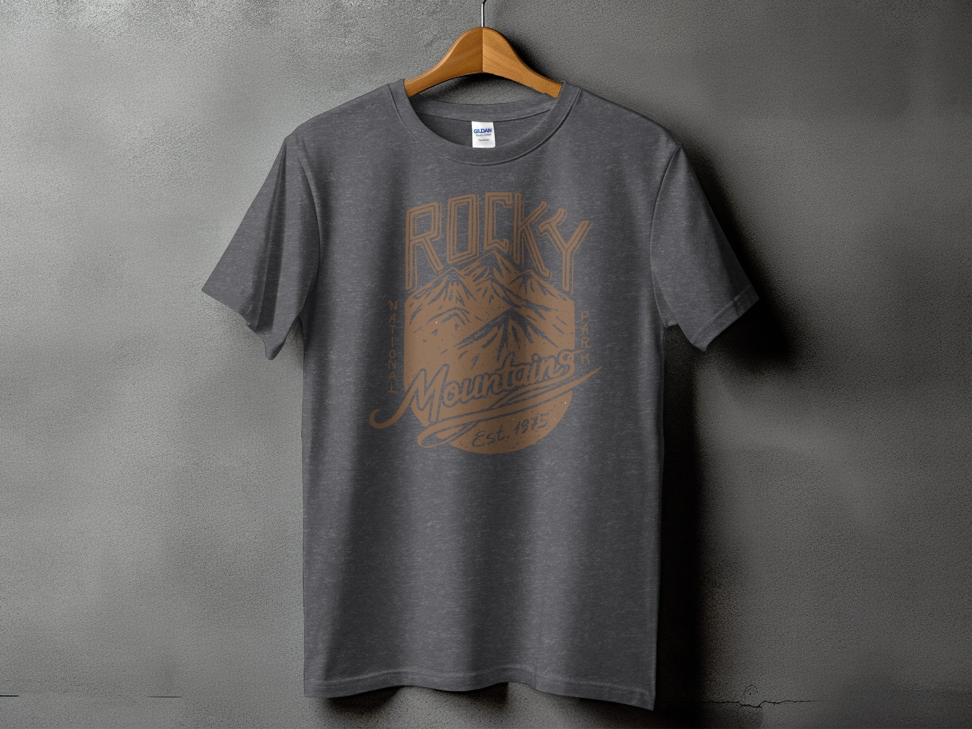 Dark gray t-shirt with "Rocky Mountains" graphic and "Est. 1975" text.