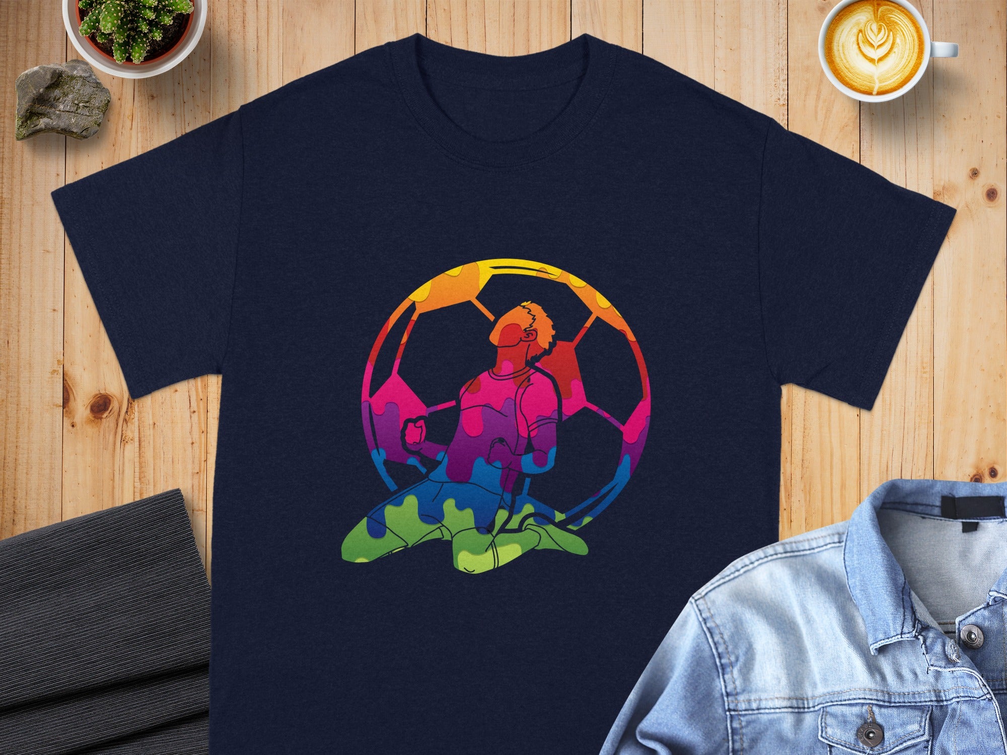 Dark navy t-shirt with vibrant, colorful soccer player graphic.