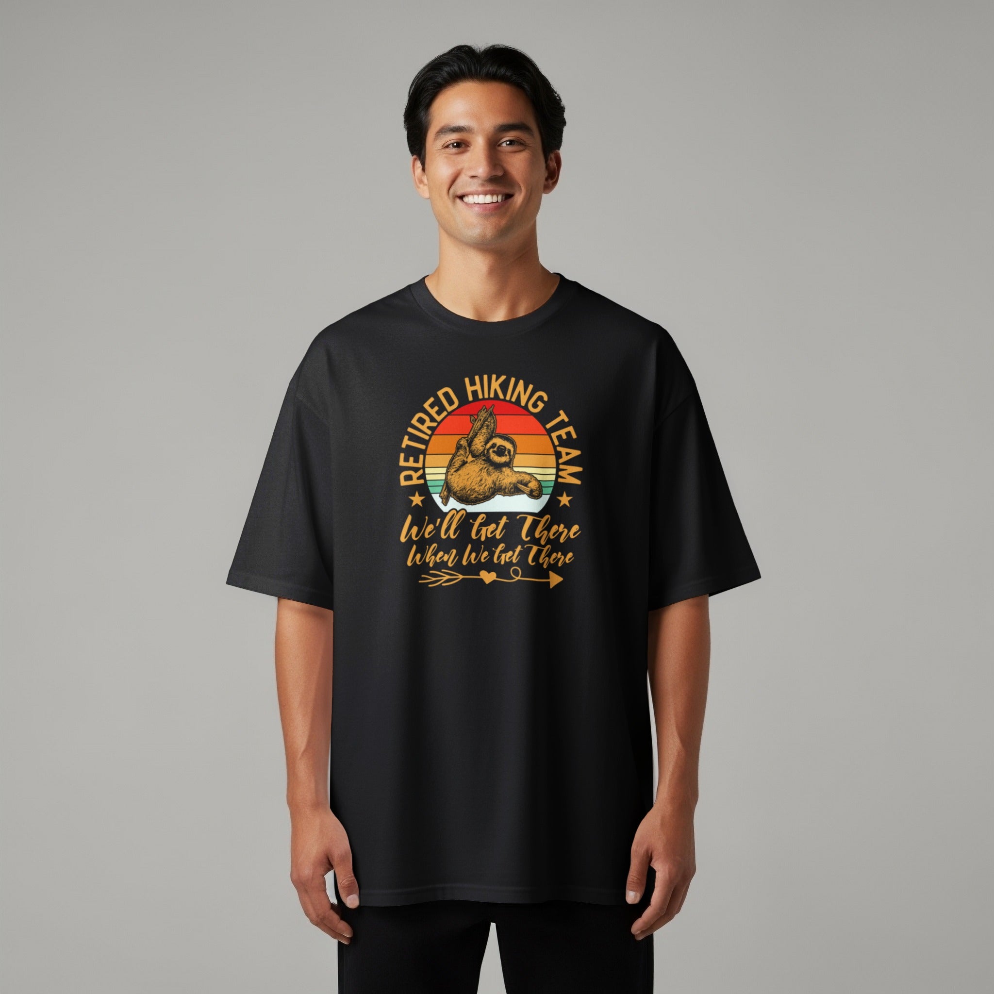 Black t-shirt with "Retired Hiking Team, We'll Get There When We Get There" sloth graphic.