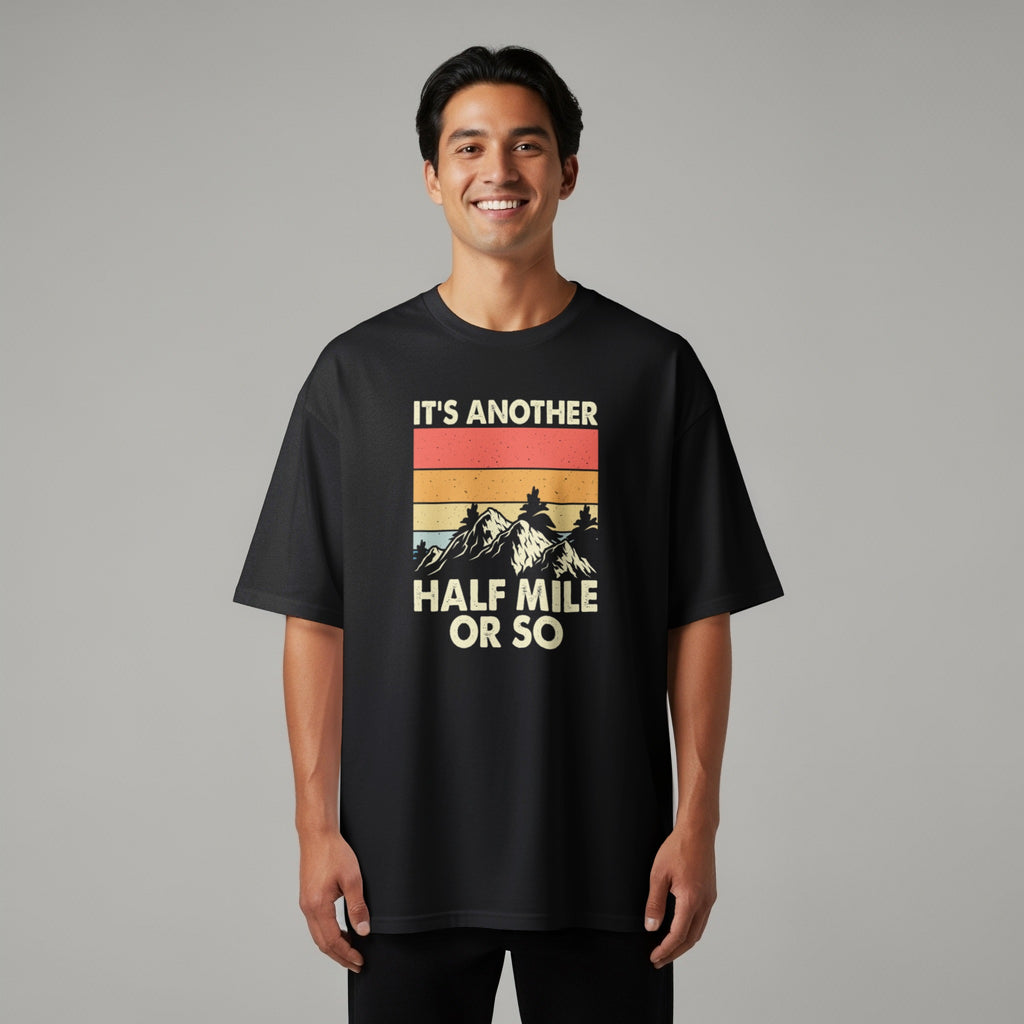 Black t-shirt with retro mountain graphic and "IT'S ANOTHER HALF MILE OR SO" text.