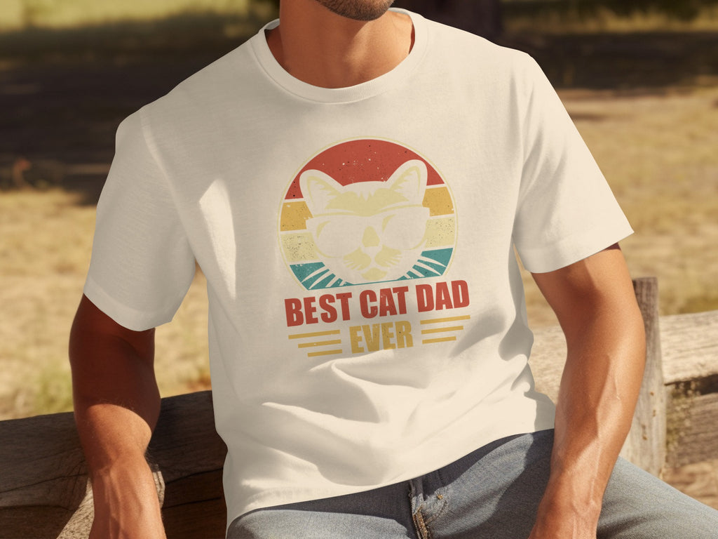 Cream t-shirt with vintage graphic of cat in sunglasses and text "BEST CAT DAD EVER".