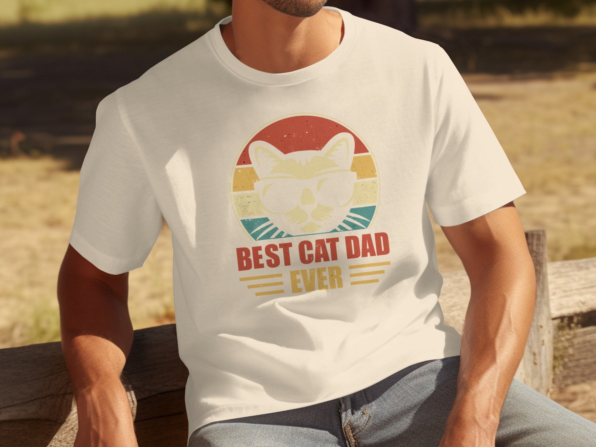 Cream t-shirt with vintage graphic of cat in sunglasses and text "BEST CAT DAD EVER".
