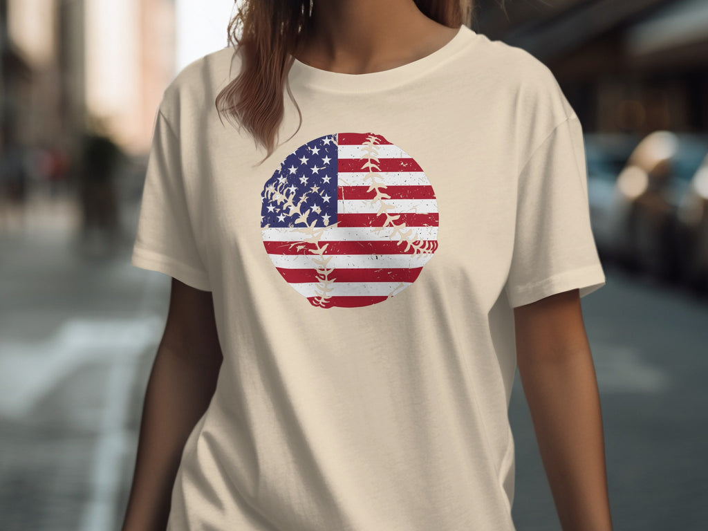 Tan t-shirt with distressed American flag baseball graphic across the chest.
