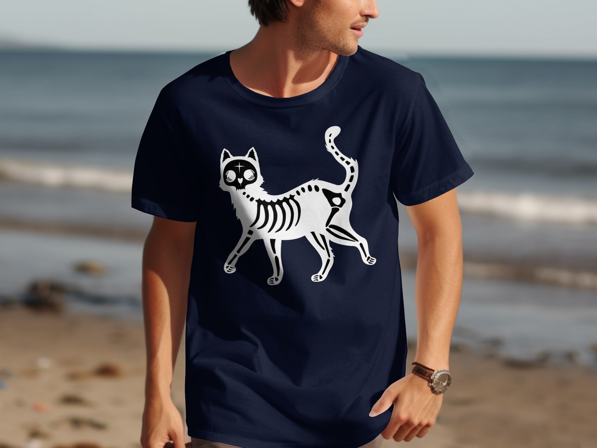 Navy t-shirt with a white skeleton cat graphic and a cross on its forehead.