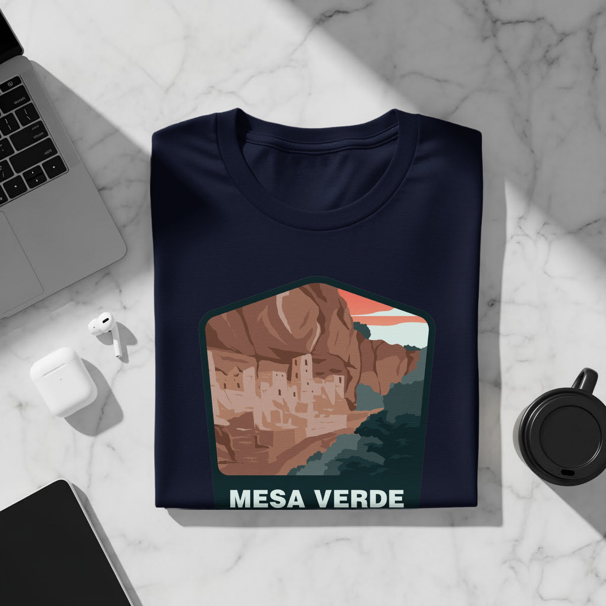 Navy t-shirt with a Mesa Verde cliff dwelling illustration and text.