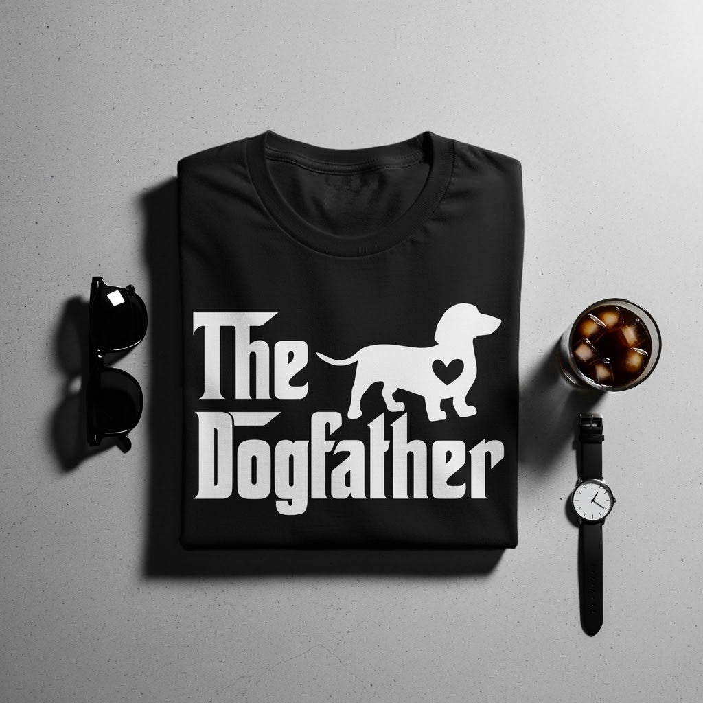 Black t-shirt with white "The Dogfather" text and dachshund silhouette.