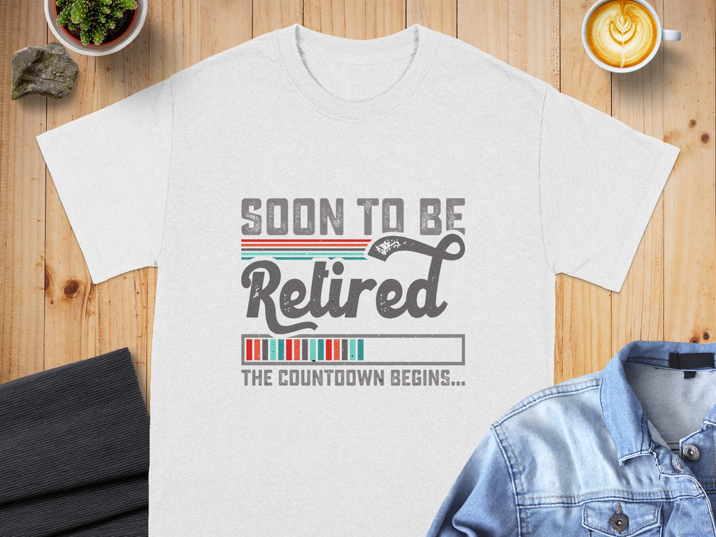 White t-shirt with "Soon to be Retired" text and a progress bar.