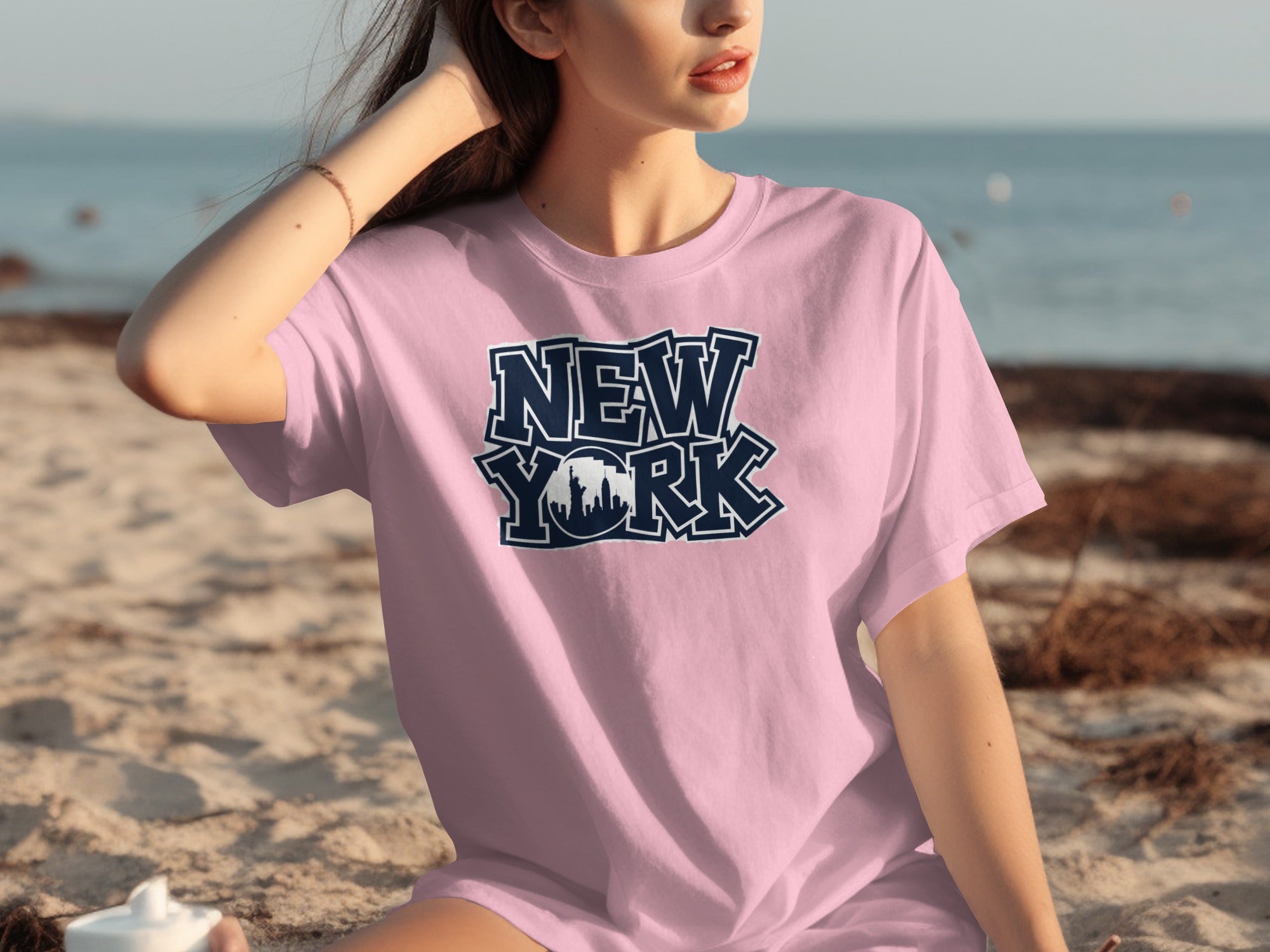 Pink t-shirt with "New York" text and skyline graphic.