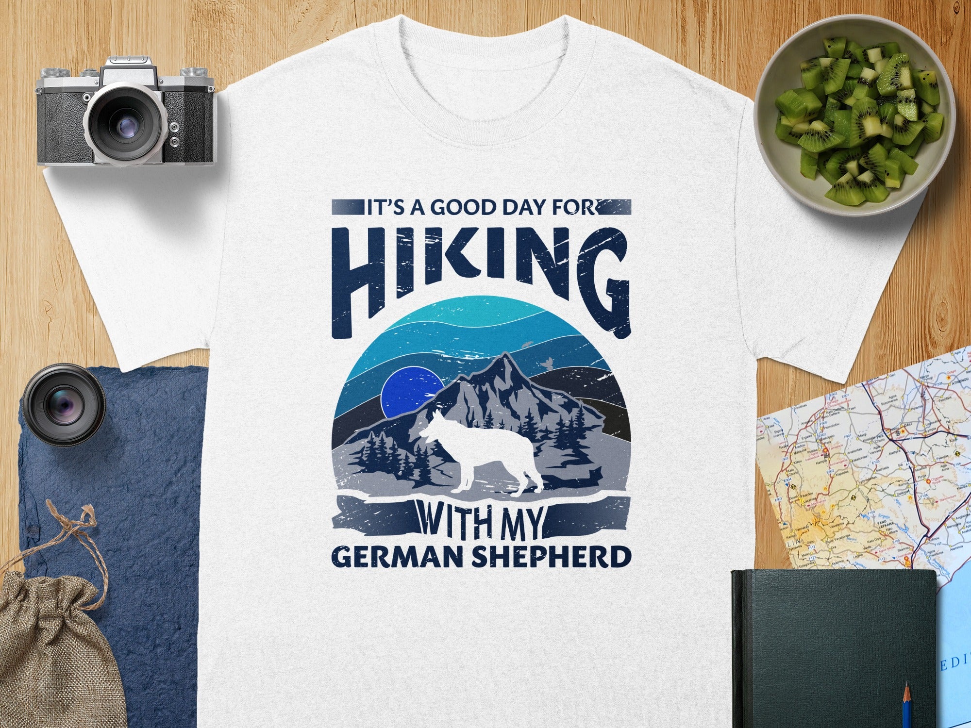 White t-shirt with graphic: "It's a good day for hiking with my German Shepherd."
