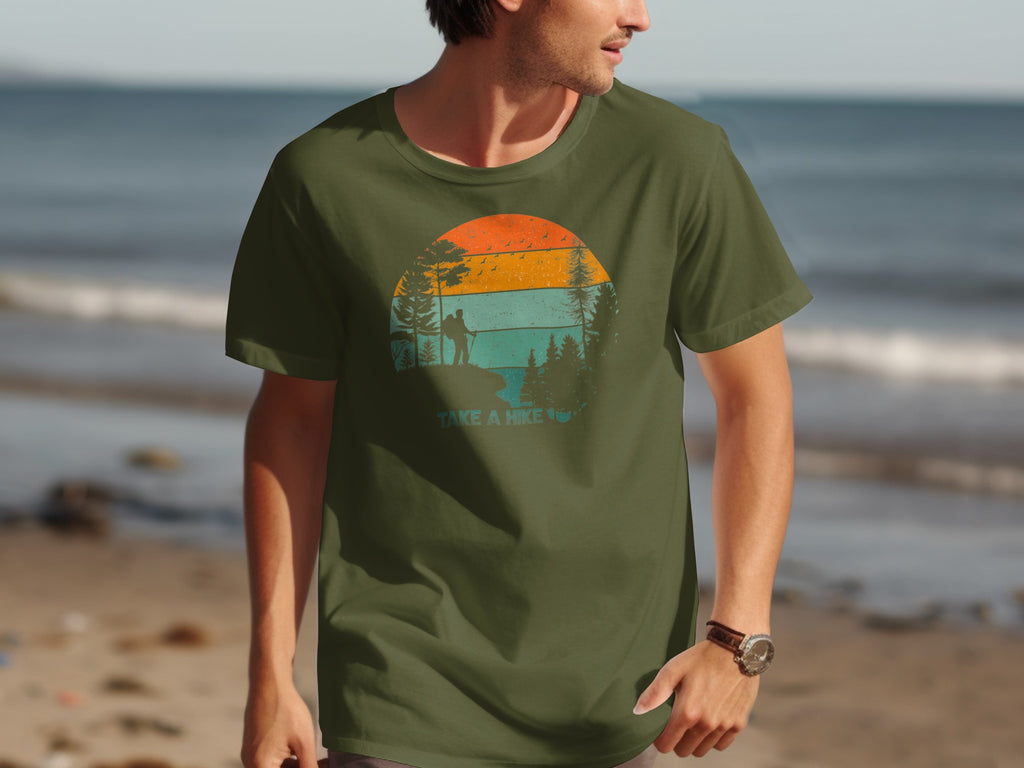 Green t-shirt with "Take a Hike" graphic featuring a sunset and hiker silhouette.
