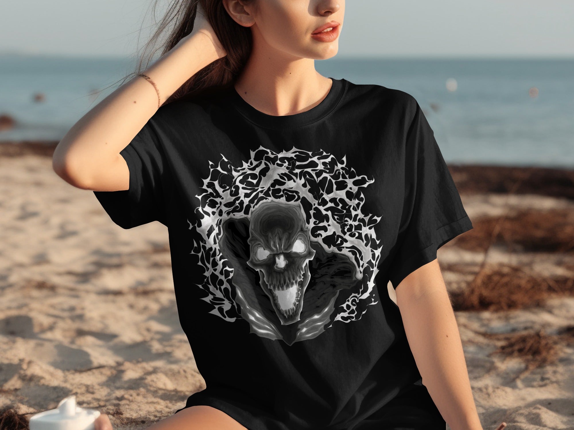 Black t-shirt with a detailed graphic skull surrounded by a smoky, abstract pattern.