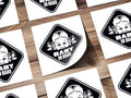 "Baby on Board" sticker featuring a child's face with pigtails.